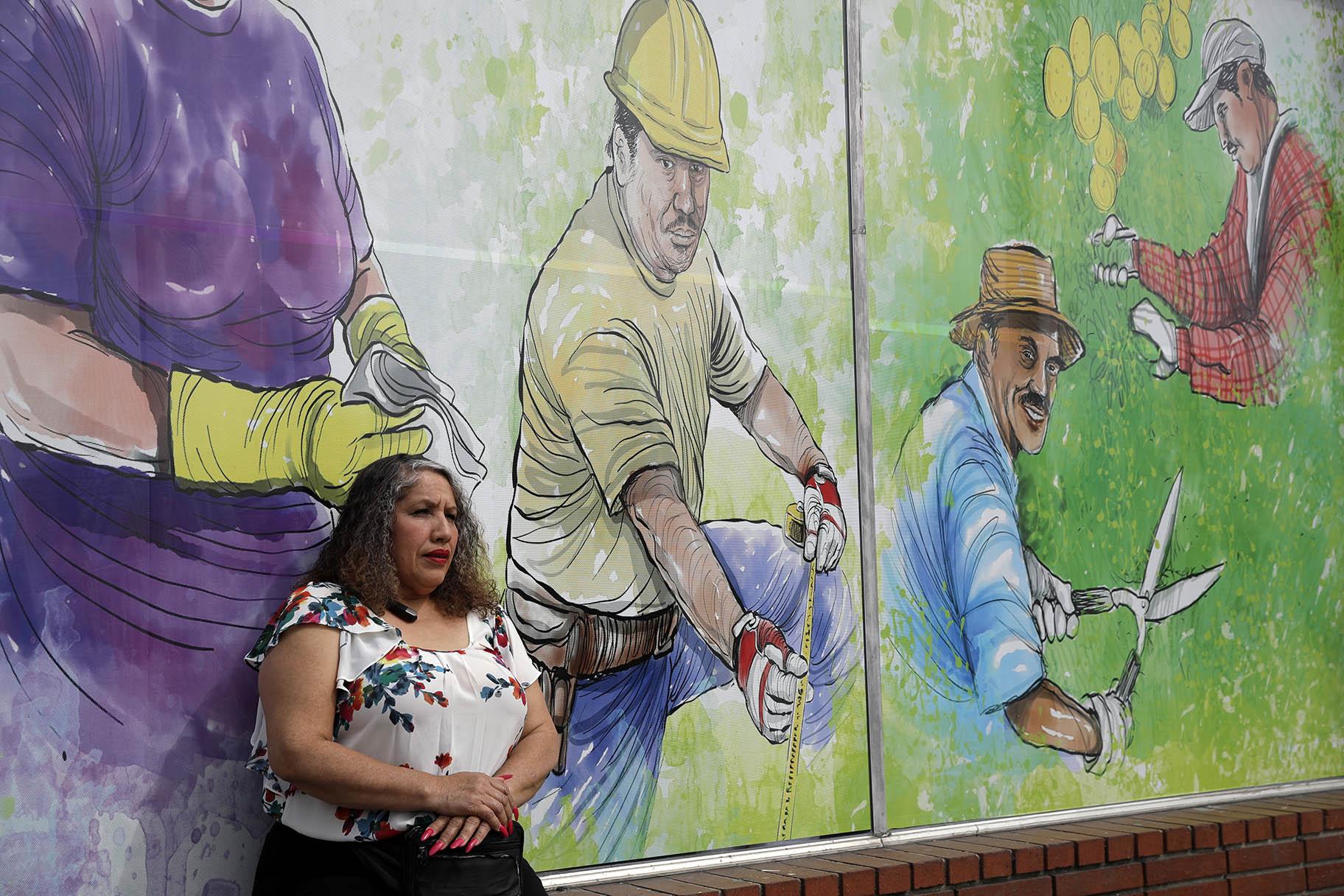 In this March 31, 2020, photo, Maria Zamorano poses for portrait inside of a job placement center in Pasadena, Calif. (AP Photo / Marcio Jose Sanchez)