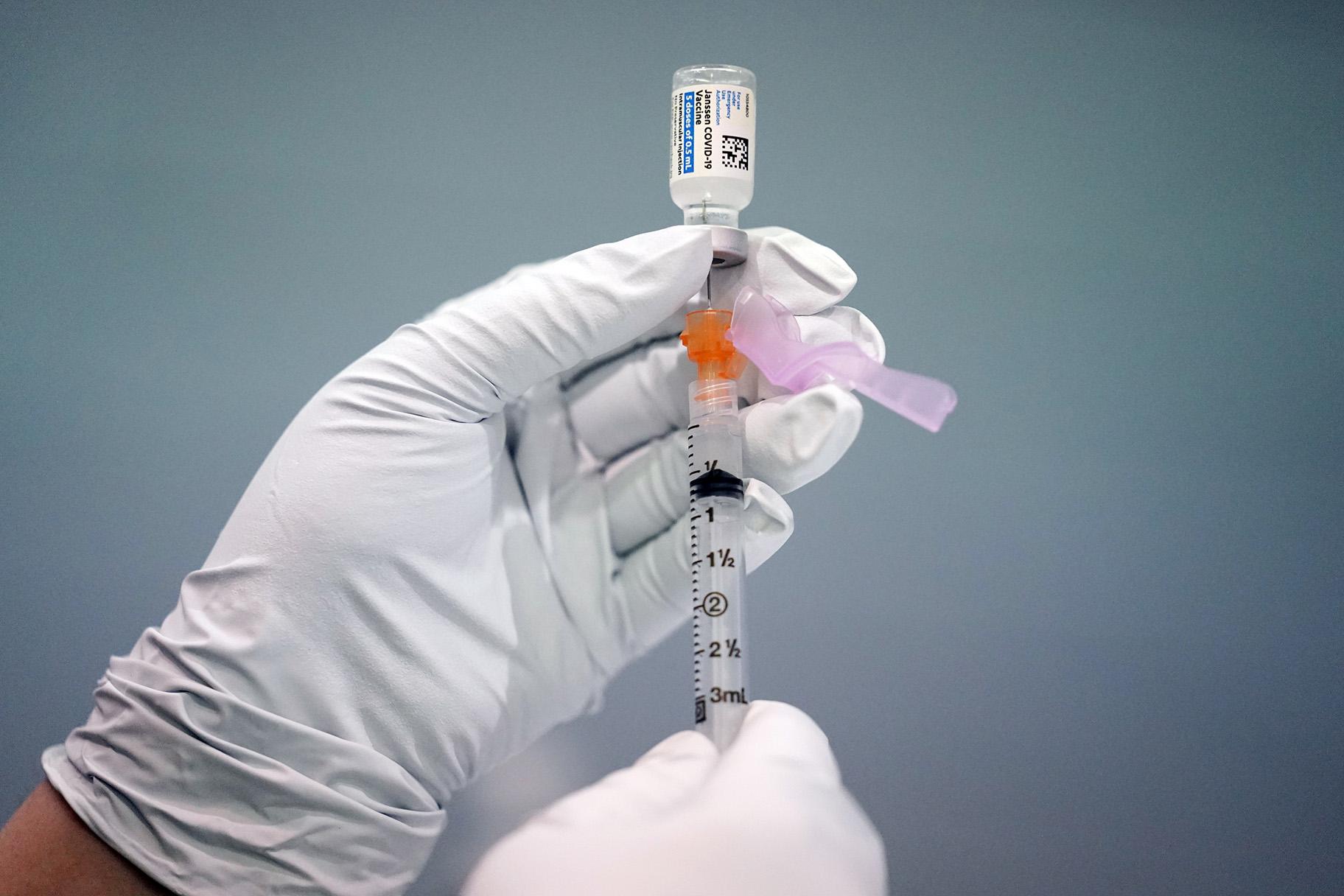 In this March 26, 2021, file photo a member of the Philadelphia Fire Department prepares a dose of the Johnson & Johnson COVID-19 vaccine at a vaccination site setup in Philadelphia. (AP Photo / Matt Rourke, File)