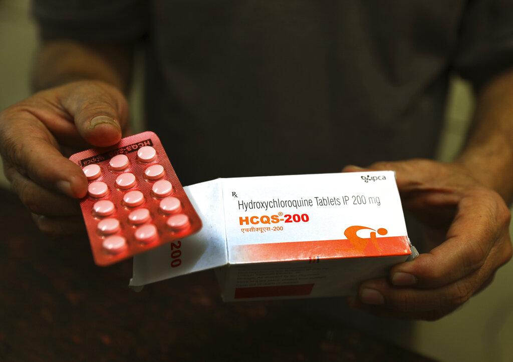 In this April 9, 2020 file photo, a chemist displays hydroxychloroquine tablets in New Delhi, India. (AP Photo / Manish Swarup, File)