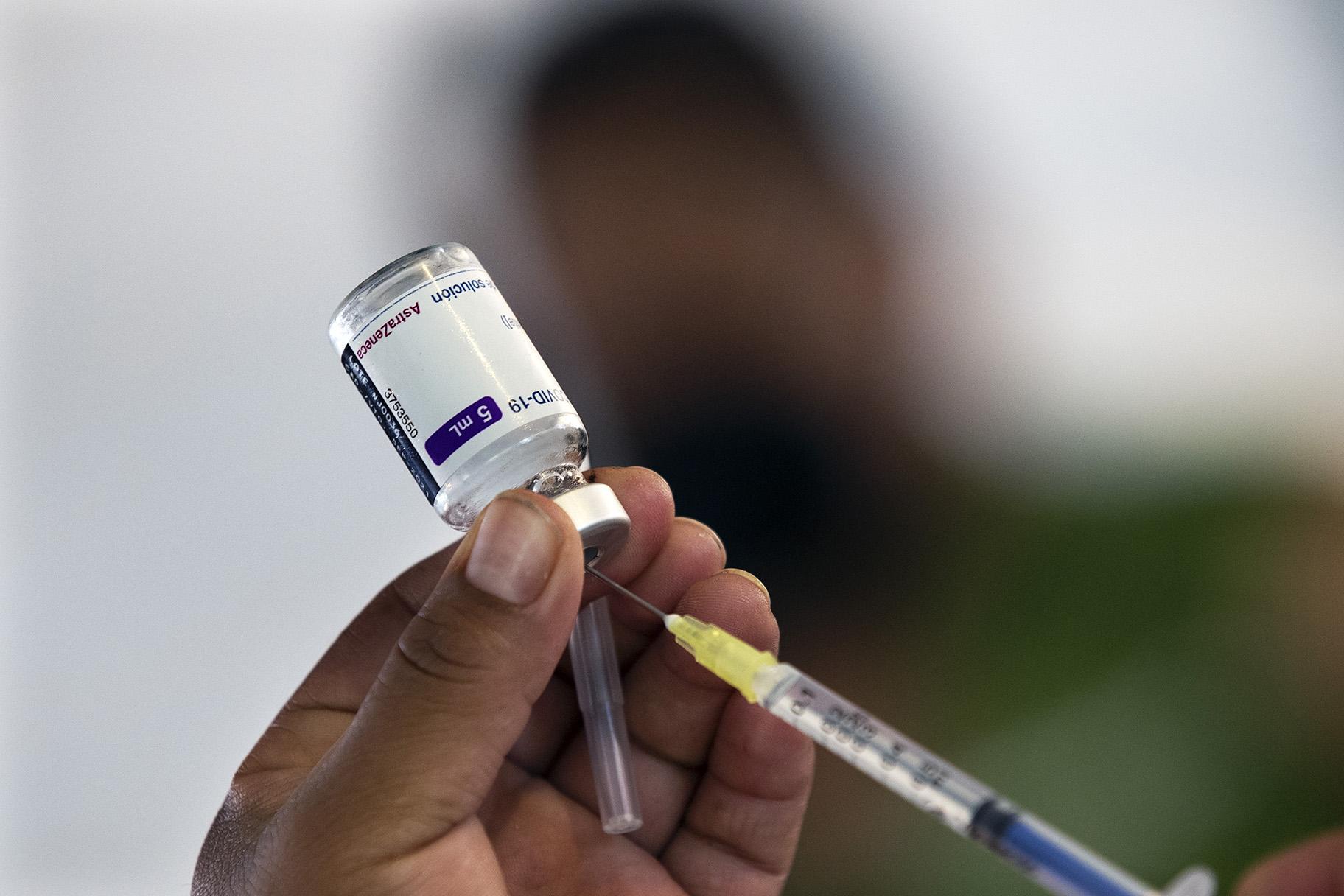 A health worker prepares to administer a jab of the AstraZeneca COVID-19 vaccine during a vaccination drive for people ages 30 to 39 in Mexico City, Wednesday, July 7, 2021. (AP Photo / Marco Ugarte)