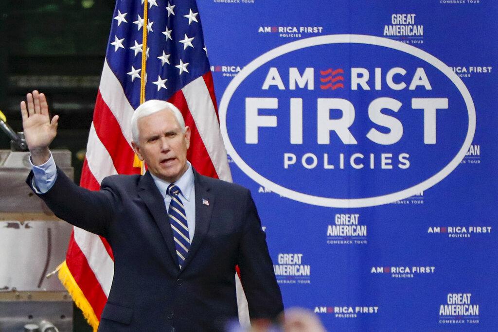 In this June 12, 2020, file photo, Vice President Mike Pence waves as he arrives to speak after a tour at Oberg Industries plant in Sarver, Pa. (AP Photo / Keith Srakocic, File)