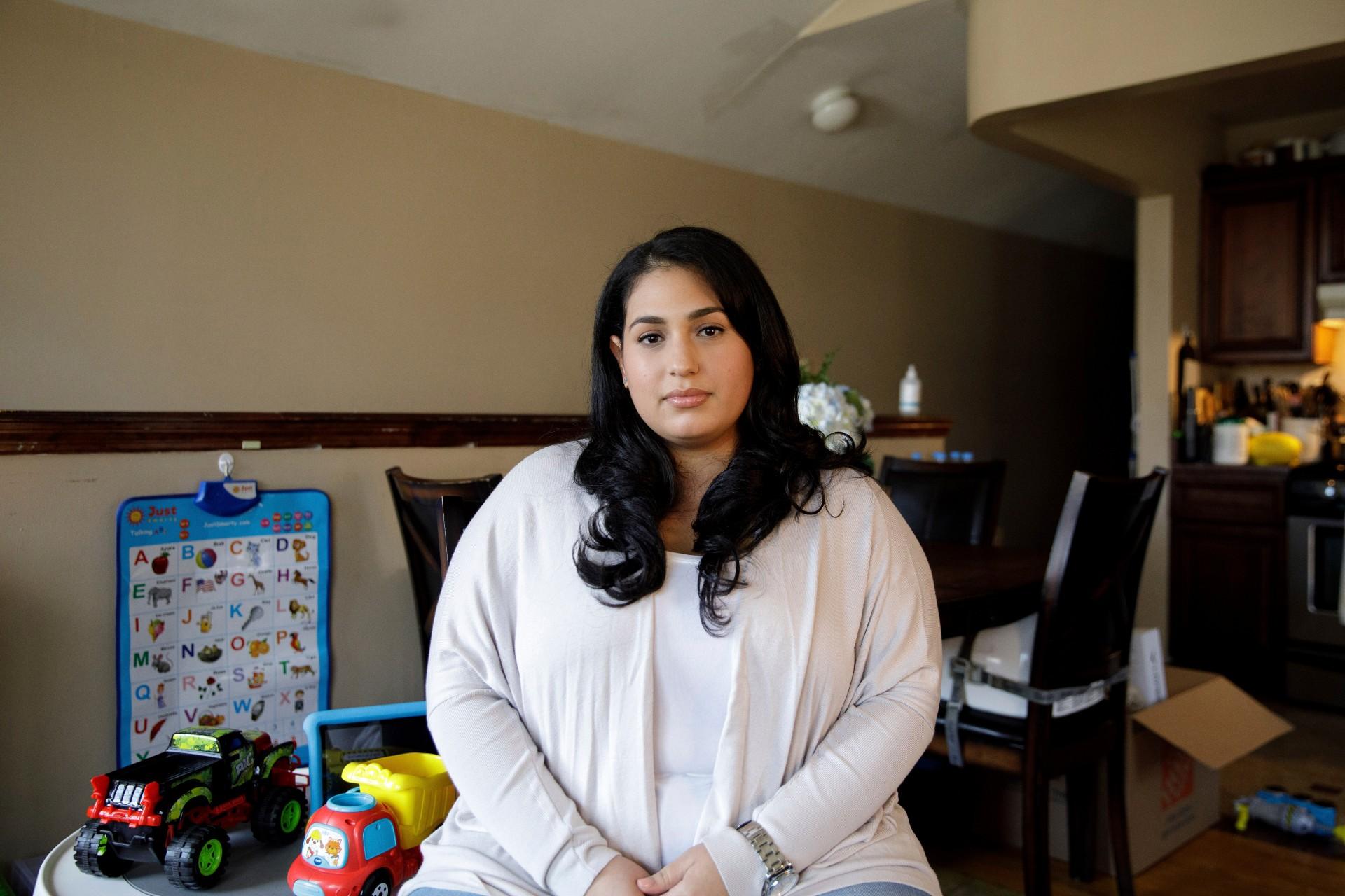 Priscilla Medina poses for a portrait in her home in Queens in New York on Wednesday, April 7, 2021. (AP Photo / Marshall Ritzel)