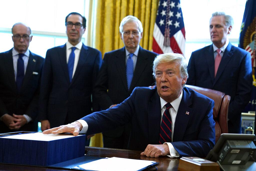 President Donald Trump speaks before he signs the coronavirus stimulus relief package in the Oval Office at the White House, Friday, March 27, 2020, in Washington.(AP Photo / Evan Vucci)
