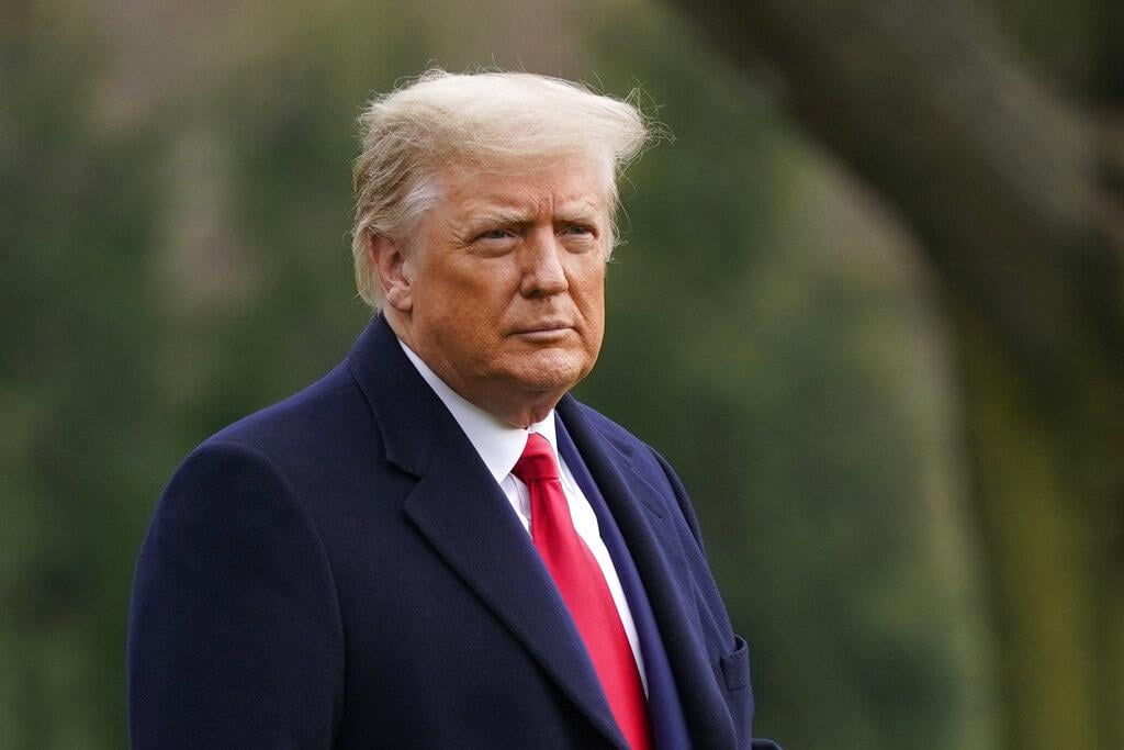 In this Dec. 12, 2020, file photo President Donald Trump walks on the South Lawn of the White House in Washington before boarding Marine One. (AP Photo / Patrick Semansky, File)