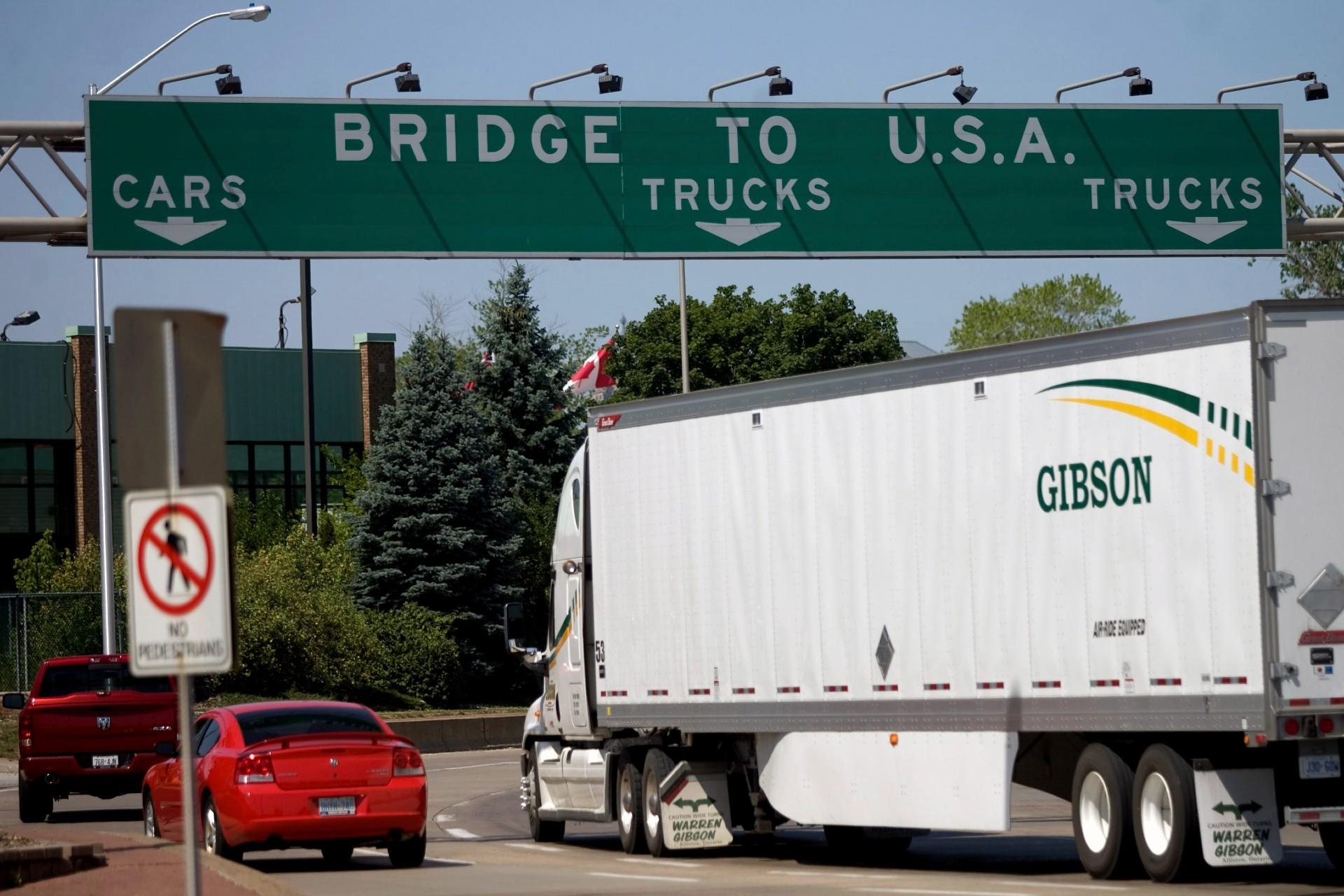 In this Friday June 15, 2012 file photo, Motorists make their way to Ambassador Bridge connecting Canada to the United States in Windsor, Ontario. (Mark Spowart / The Canadian Press via AP, File)