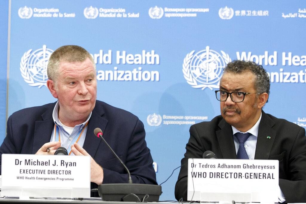 In this Monday, Feb. 24, 2020 file photo, Michael Ryan, left, Executive Director of WHO's Health Emergencies program, next to Tedros Adhanom Ghebreyesus, right, Director General of the World Health Organization (WHO), addresses a press conference about the update on COVID-19 at the World Health Organization headquarters in Geneva, Switzerland. (Salvatore Di Nolfi / Keystone via AP, File)