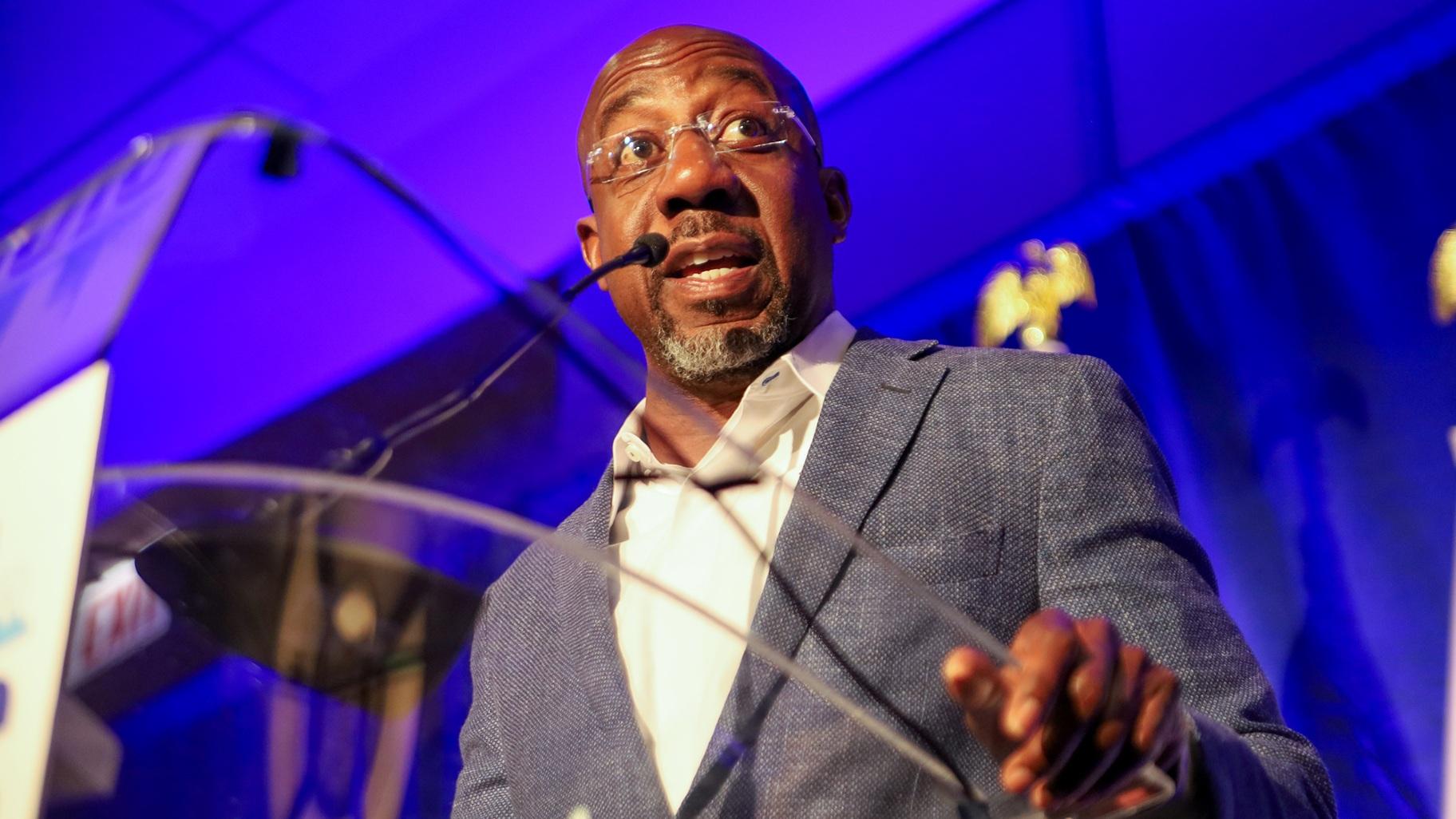 U.S. Sen. Raphael Warnock, of Georgia, on Aug. 21, 2024, tells the Illinois delegation that amid momentum for the Harris-Walz ticket, ‘We got to go down in the valley and do the work.’  (Andrew Adams / Capitol News Illinois) 