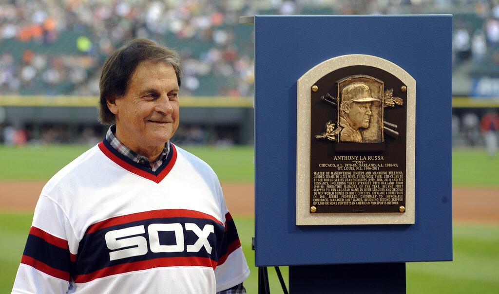In this Aug. 30, 2014, file photo, former Chicago White Sox manager Tony La Russa stands with his Baseball Hall of Fame plaque before the second baseball game of a doubleheader against the Detroit Tigers in Chicago. (AP Photo / Matt Marton, File)
