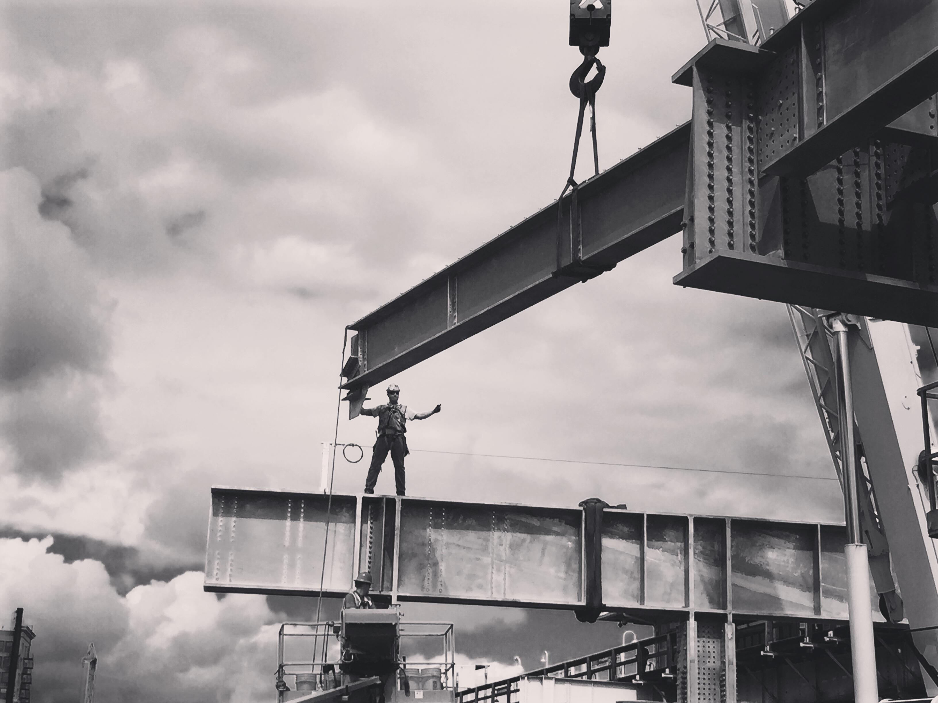 Intersection of art and life: A photo display at an Uptown coffee shop offers behind-the-scenes views of the Wilson station reconstruction project. (Kirsten Lefeldt)