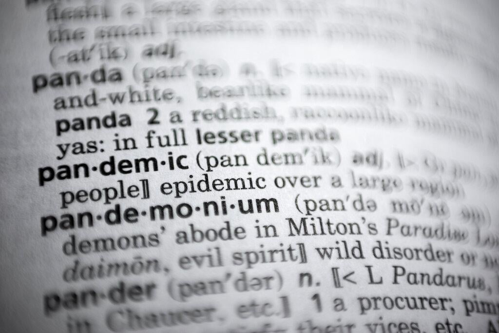 In this Saturday, Nov. 21, 2020, photo the word pandemic is displayed in a dictionary in Washington. Merriam-Webster on Monday announced “pandemic” as its 2020 word of the year. (AP Photo / Jenny Kane)