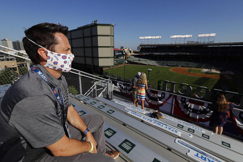 Cubs executive vice president of sales and marketing Colin Faulkner looks to the field from the Wrigley Rooftop before the Opening Day baseball game between the Chicago Cubs and the Milwaukee Brewers in Chicago, Friday, July 24, 2020, in Chicago. (AP Photo / Nam Y. Huh)