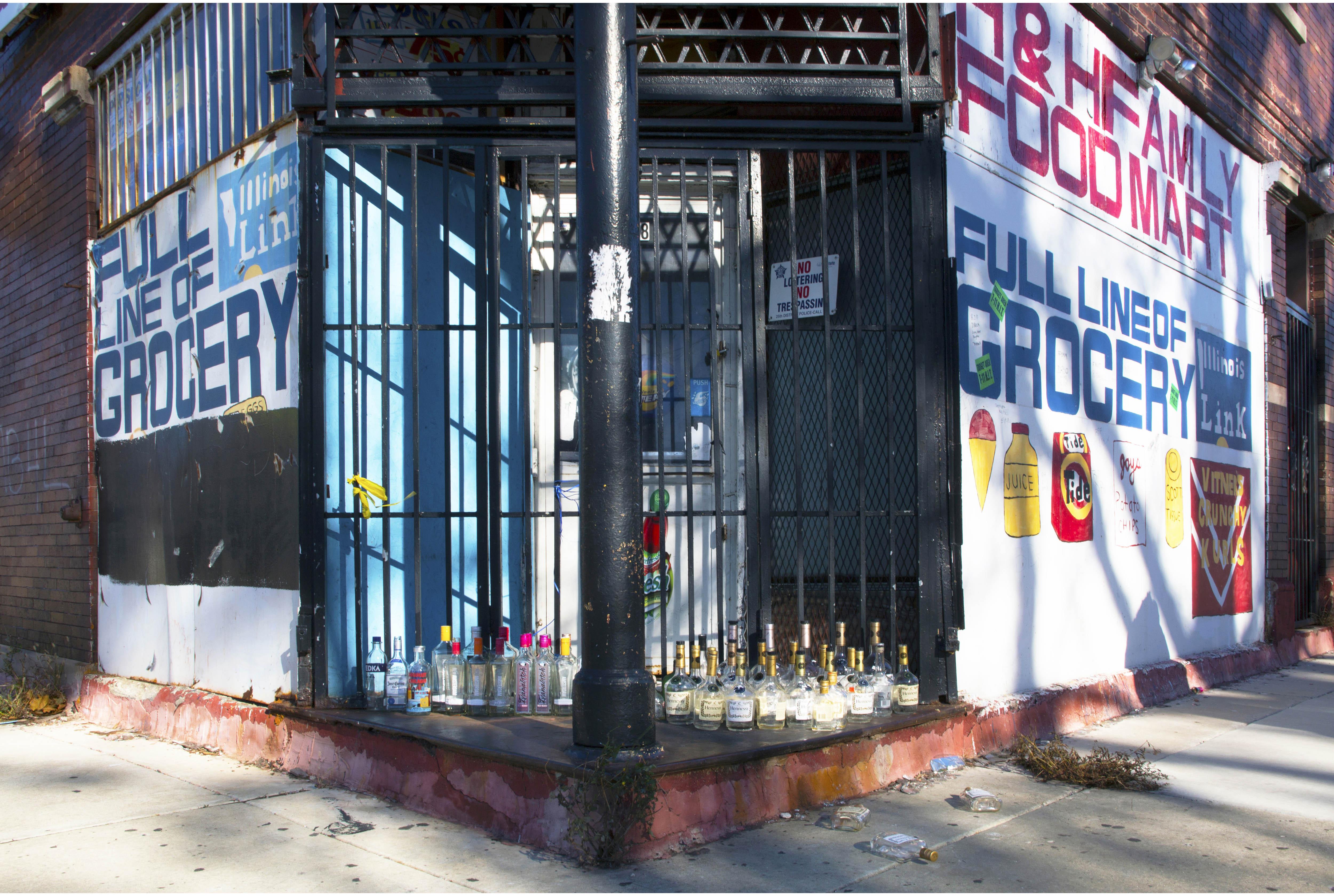 Rows of liquor bottles pay homage to a man killed in Englewood. (Courtesy of Thomas Ferrella)