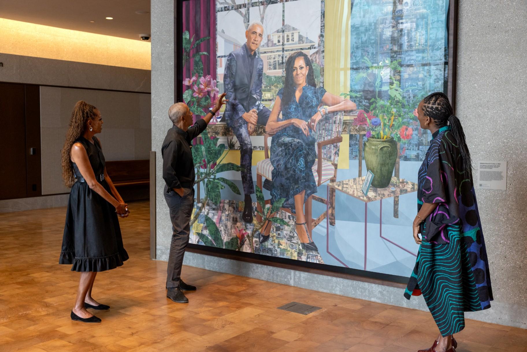 Former President Barack Obama and former first lady Michelle Obama view their portrait by artist Njideka Akunyili Crosby in the Obama Presidential Center Museum's Hope and Change Lobby on June 14, 2026. (Courtesy of The Obama Foundation)