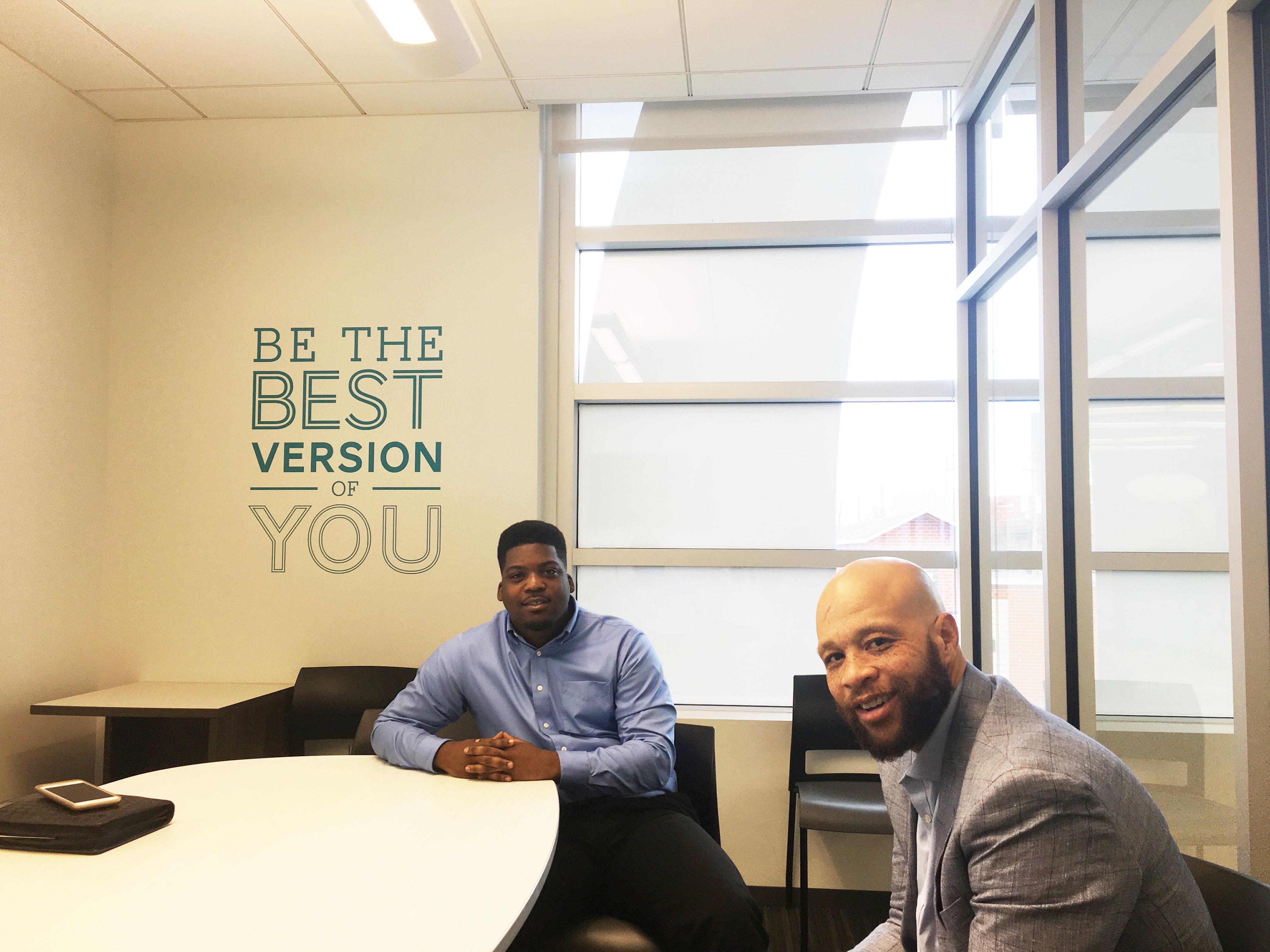 Anthony Green, left, and his youth development coach Patrick Daniels at the UCAN headquarters in North Lawndale. (Maya Miller / Chicago Tonight) 