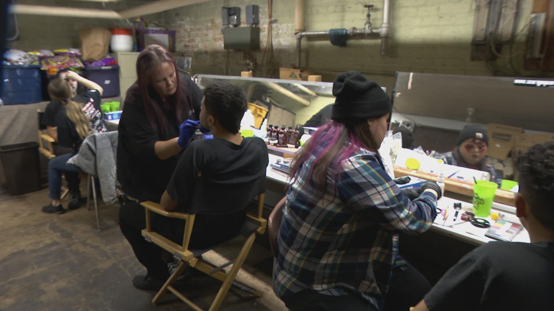 Volunteers and characters prepare at The Catacombs at St. Pascal Catholic Church (WTTW News)