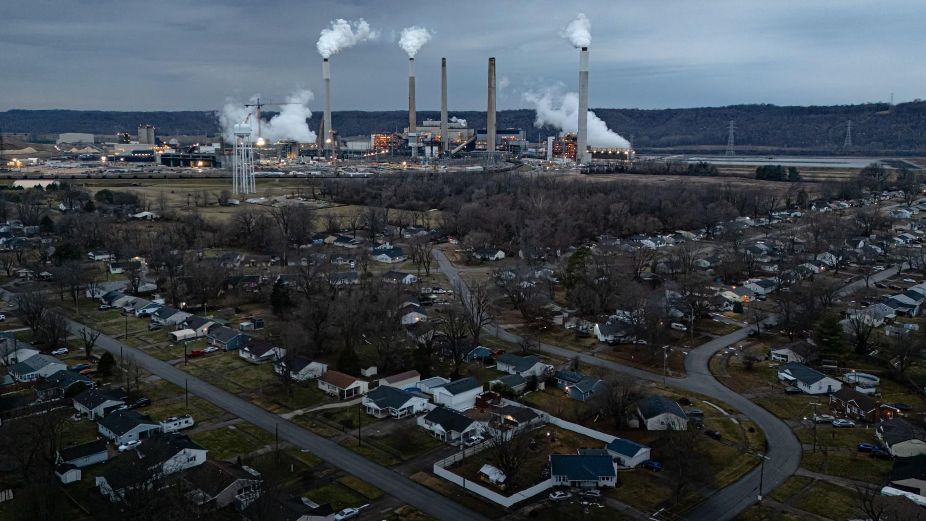The Mill Creek Generating Station, a coal-fired power plant, hovers over a Louisville neighborhood on Feb. 14, 2026. (Jon Cherry / Getty Images via CNN Newsource)