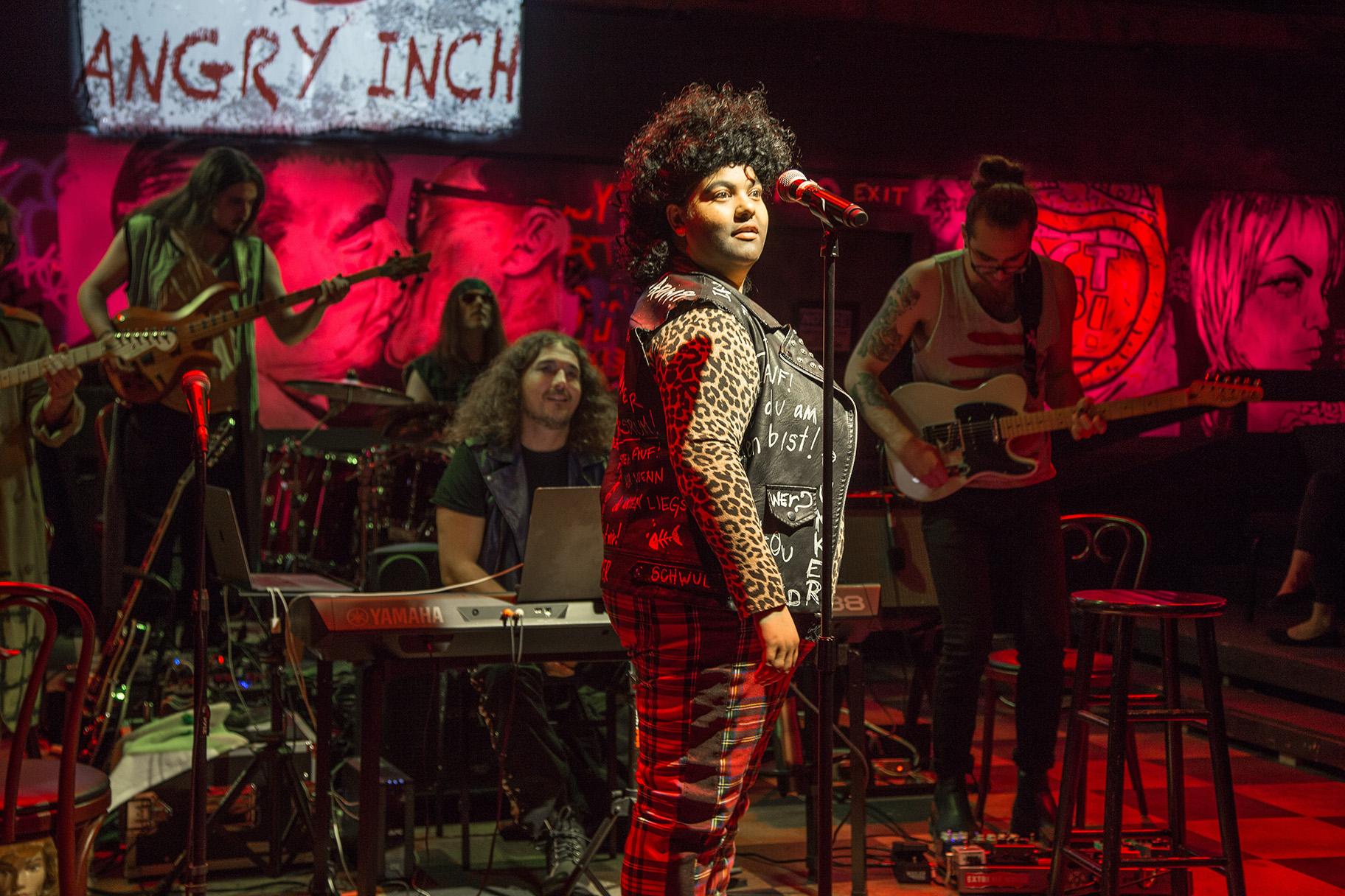 Brittney Brown, center, in “Hedwig and the Angry Inch.” Background: Perry Cowdery, Joseph Drzemiecki, Carlos Mendoza, Jeremy Ramey and Jakob Smith. (Photo by Austin D. Oie Photography)