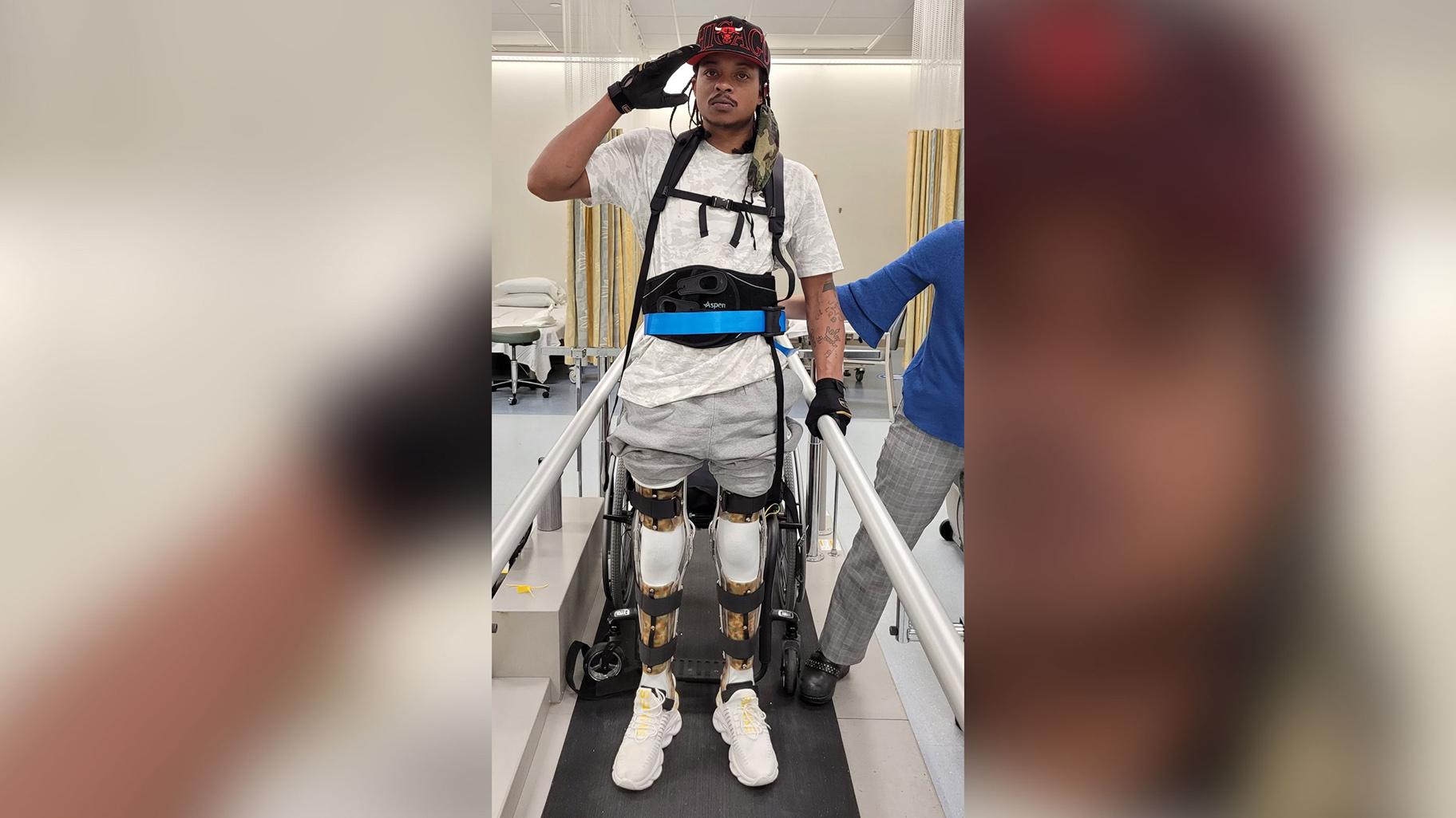 Jacob Blake fully stands on heavily braced legs during a mid-August 2021 physical rehabilitation session. (Courtesy Jacob Blake)