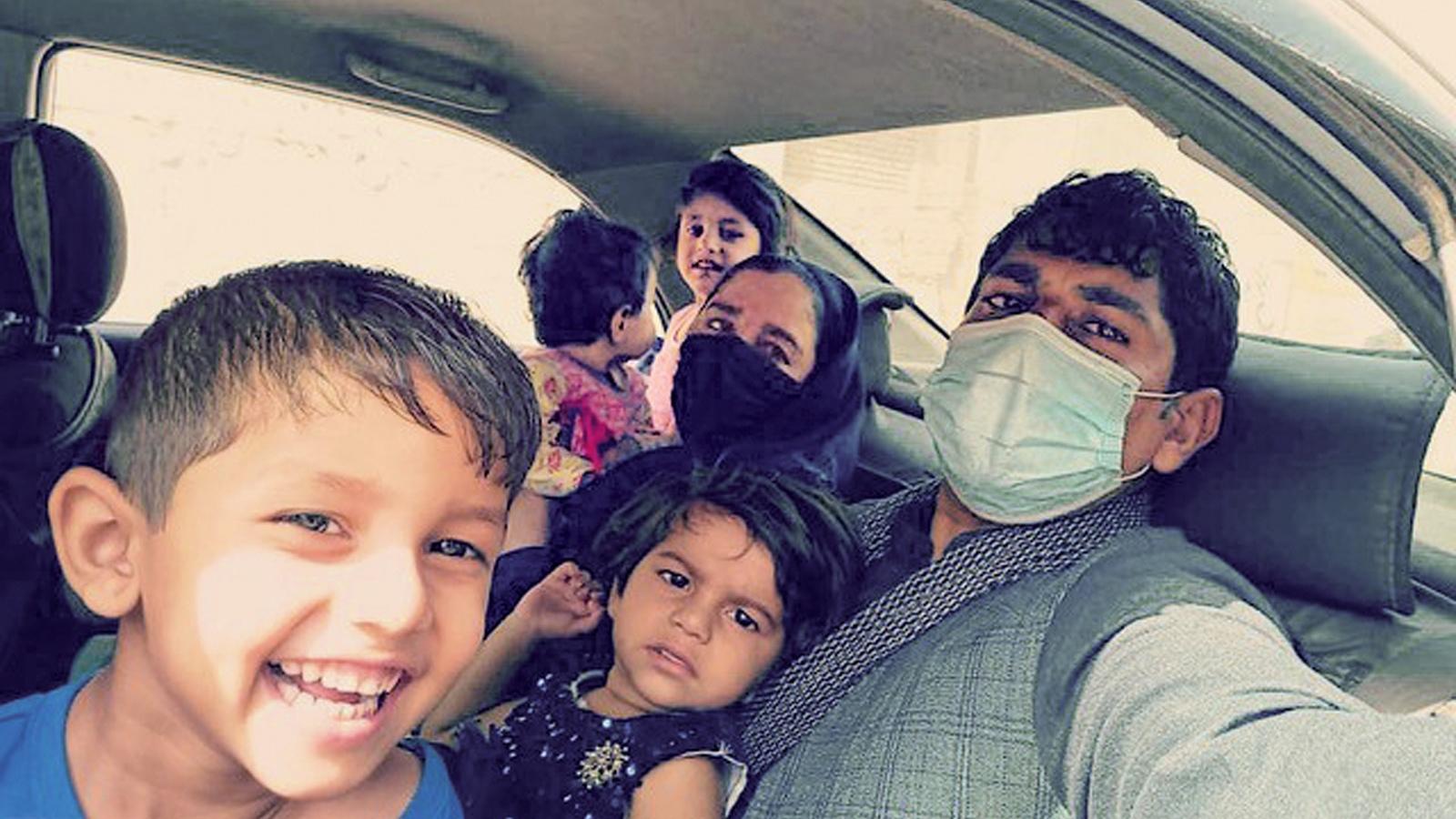 Zainullah Zaki and his family on Aug. 18, 2021, after they made it to Hamid Karzai International Airport to evacuate Afghanistan. (Courtesy of Zainullah Zaki)
