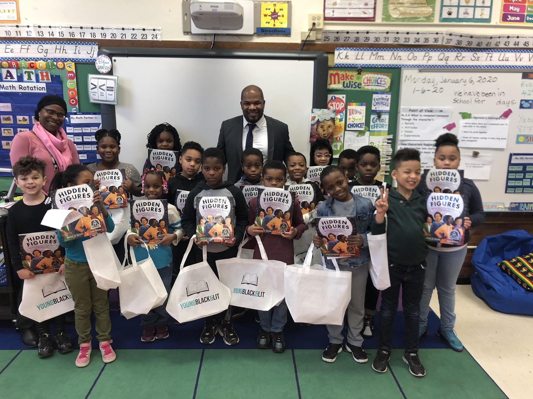 An elementary class in Evanston, Illinois, receives free books from the nonprofit Young, Black & Lit, whose mission is to give away books with Black main characters. (Courtesy of Young, Black & Lit)