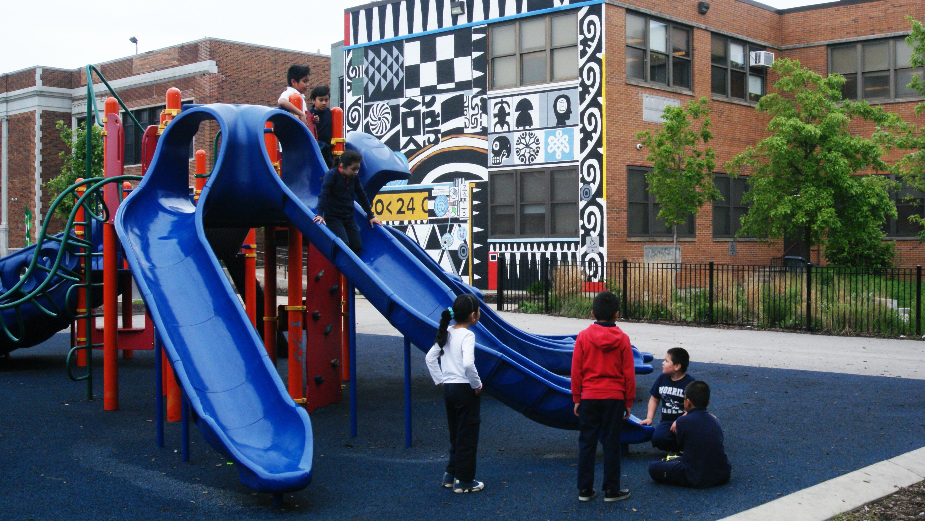 Asphalt once surrounded the Donald Morrill Math & Science Elementary School. Now, there is a playground, soccer field, basketball court and running track. (Courtesy of Southwest Organizing Project, Chicago)