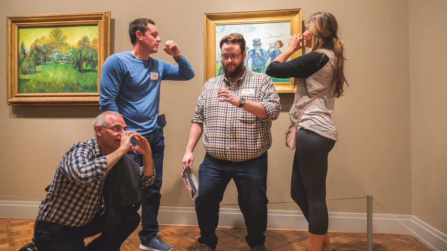 While on a Museum Hack tour at the Art Institute of Chicago, visitors strike a pose in front of the artwork. (Courtesy of Museum Hack)