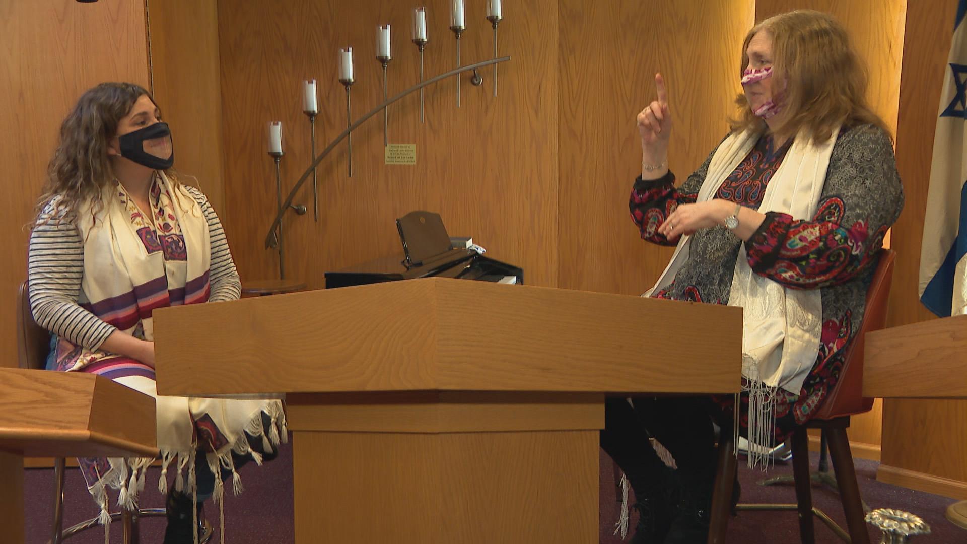 Rabbinical student Sari Daybook, left, and Rabbi Shari Chen communicate through American Sign Language at Bene Shalom synagogue in Skokie on Feb. 5, 2021. (WTTW News)