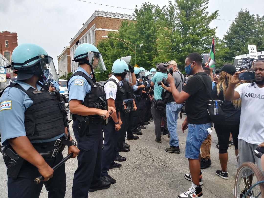 Chicago police officers redirect a planned march onto the Dan Ryan Expressway on Saturday, Aug. 15, 2020, on the South Side of Chicago. (Annemarie Mannion / WTTW News)