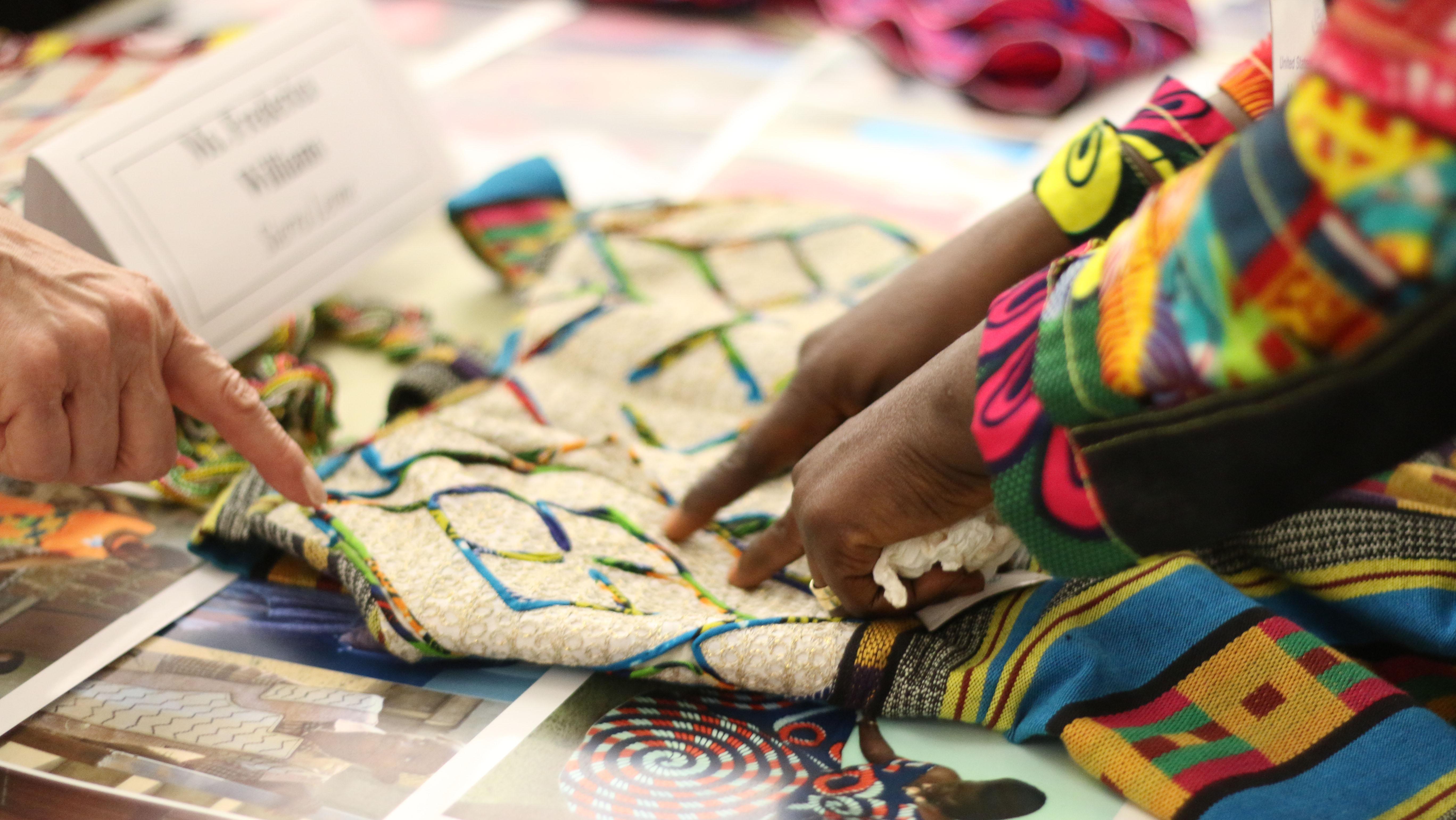 Frederica Williams, of J&F Fashion Designs in Sierra Leona, describes her work at the 2015 showcase. (Courtesy of Peggy Parfenoff)