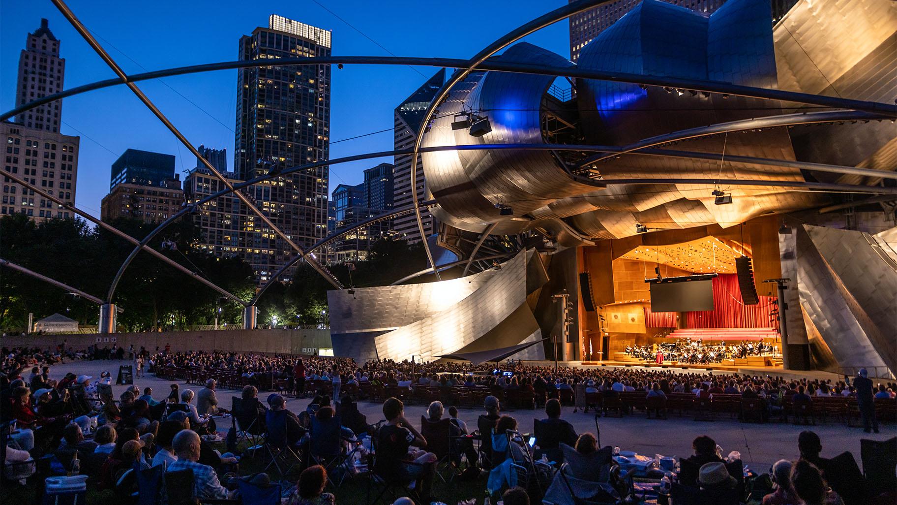 Enrique Mazzola, Lyric Opera’s Music Director and Donald Lee III, the inaugural Ryan Opera Center conductor/pianist, led the Lyric Opera Orchestra and singers from the Ryan Opera Center’s esteemed training center on the stage of the Pritzker Pavilion, Aug. 21, 2022. (Credit: Kyle Flubacker)