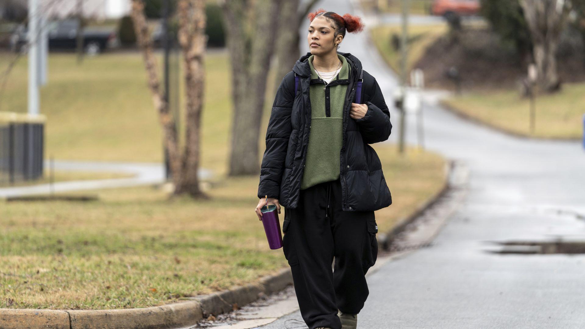 Kailani Taylor-Cribb walks through her neighborhood in Asheville, N.C., on Tuesday, Jan. 31, 2023. Kailani hasn’t taken a single class in what used to be her high school since the height of the coronavirus pandemic. She vanished from the public school roll in Cambridge, Mass., in 2021 and has been, from an administrative standpoint, unaccounted for since then. (AP Photo/Kathy Kmonicek)