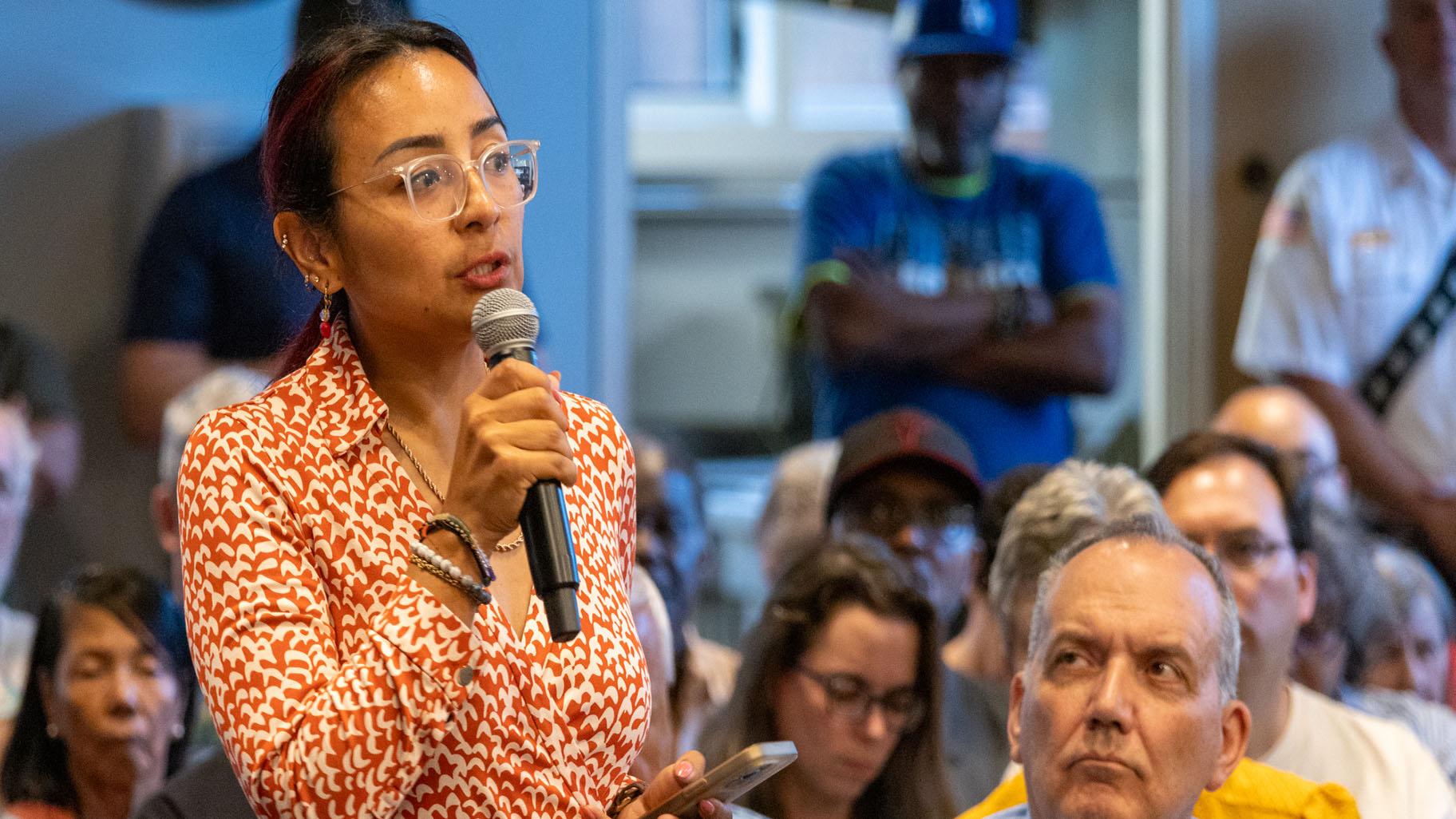 State Rep. Dagmara Avelar, D-Romeoville, speaks to an administrative judge and Illinois American Water executives at a public forum hosted by the Illinois Commerce Commission in Bolingbrook. (Andrew Adams / Capitol News Illinois)
