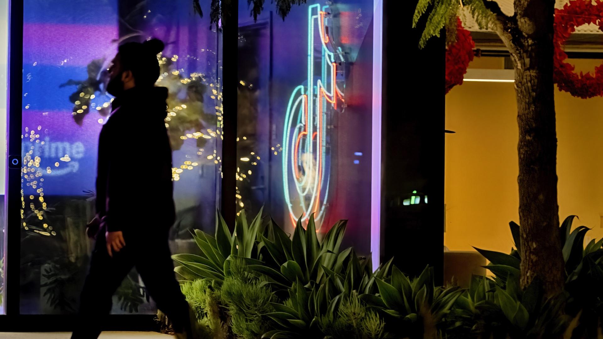 A neon TikTok logo hangs in the lobby of the TikTok office building in Culver City, Calif., on Tuesday, Dec. 3, 2024. (AP Photo/Richard Vogel)