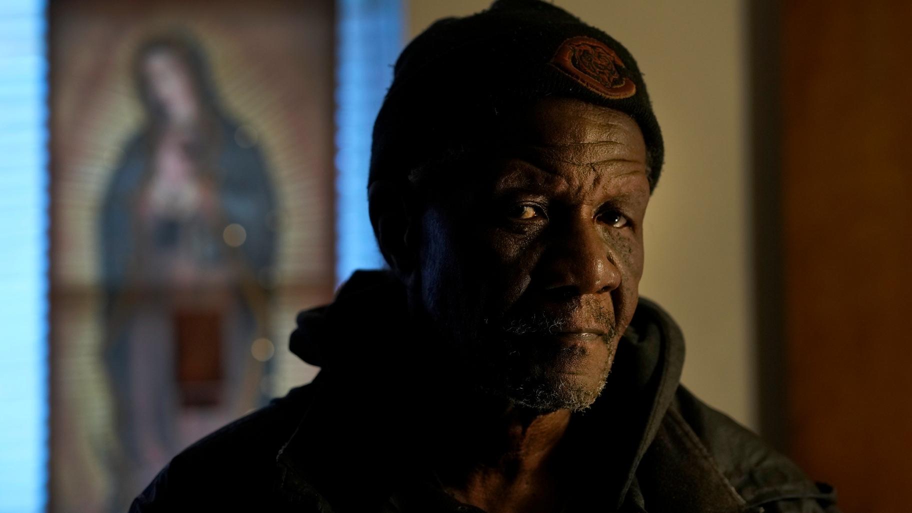 Rudolph Williams stands for a portrait in his apartment Monday, Jan. 8, 2024, in Harvey, Ill. Williams was home in the Chicago south suburb when he realized that the doors and windows to his courtyard-style apartment had been boarded up with plywood, locking him inside. (AP Photo / Charles Rex Arbogast)