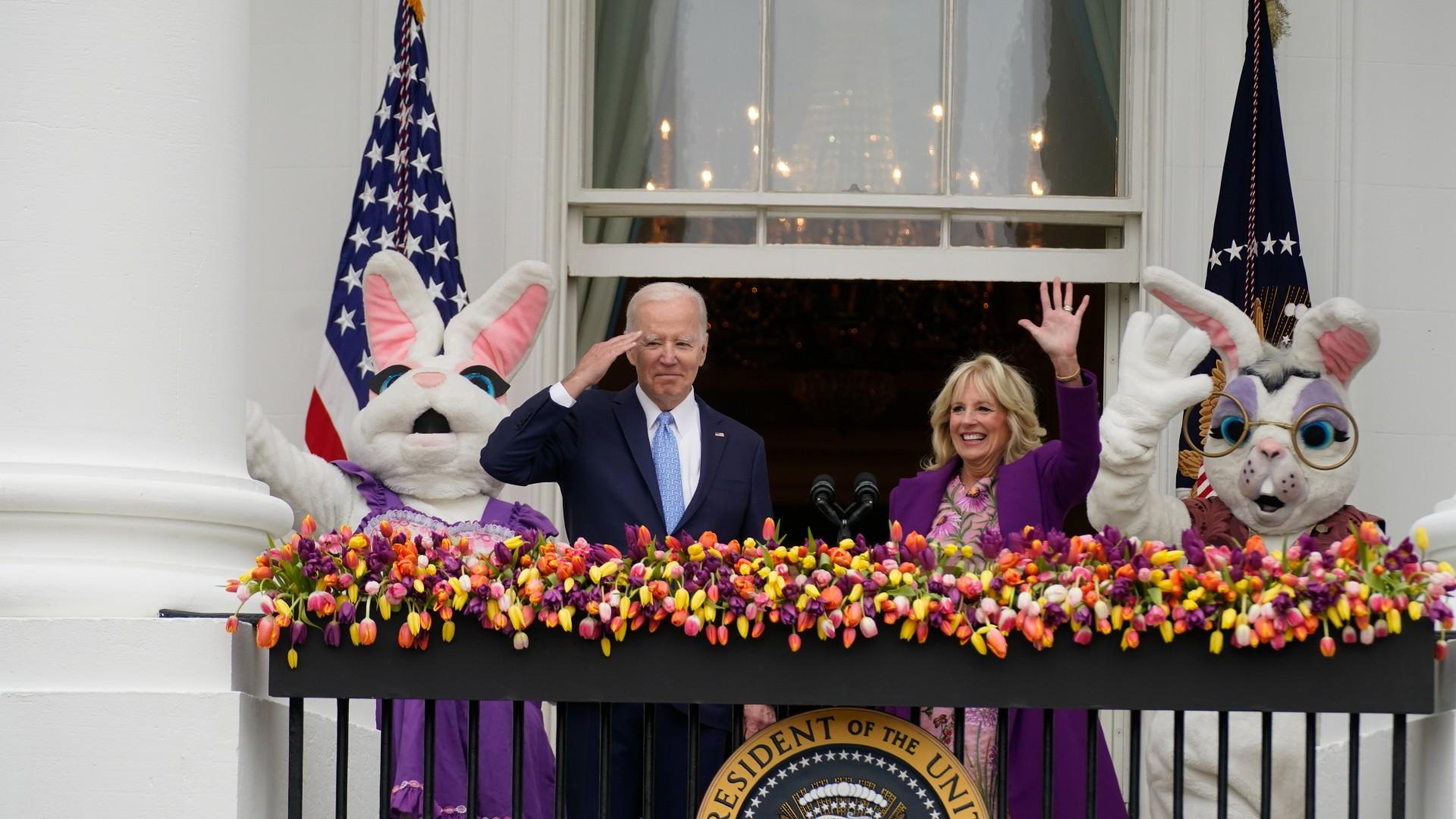 President Joe Biden appears and salutes with first lady Jill Biden and the Easter Bunnies on the Blue Room balcony at the White House during the White House Easter Egg Roll, Monday, April 18, 2022, in Washington. (AP Photo / Andrew Harnik)