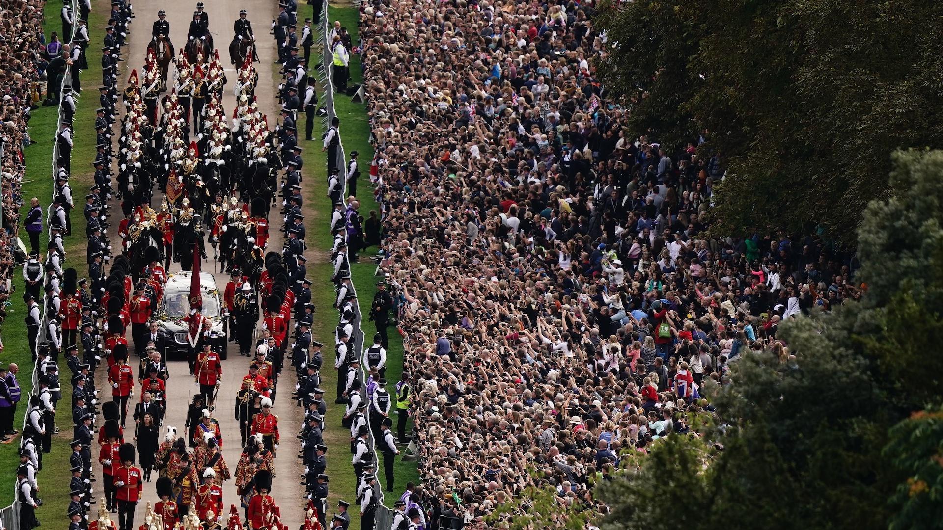 The Ceremonial Procession of the coffin of Queen Elizabeth II travels down the Long Walk as it arrives at Windsor Castle for the Committal Service at St George's Chapel, in Windsor, England, Monday, Sept. 19, 2022. (Aaron Chown/Pool photo via AP)