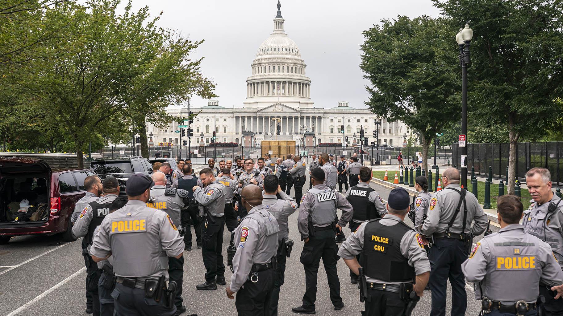 Police stage at a security fence ahead of a rally near the U.S. Capitol in Washington, Saturday, Sept. 18, 2021.  (AP Photo / Nathan Howard)