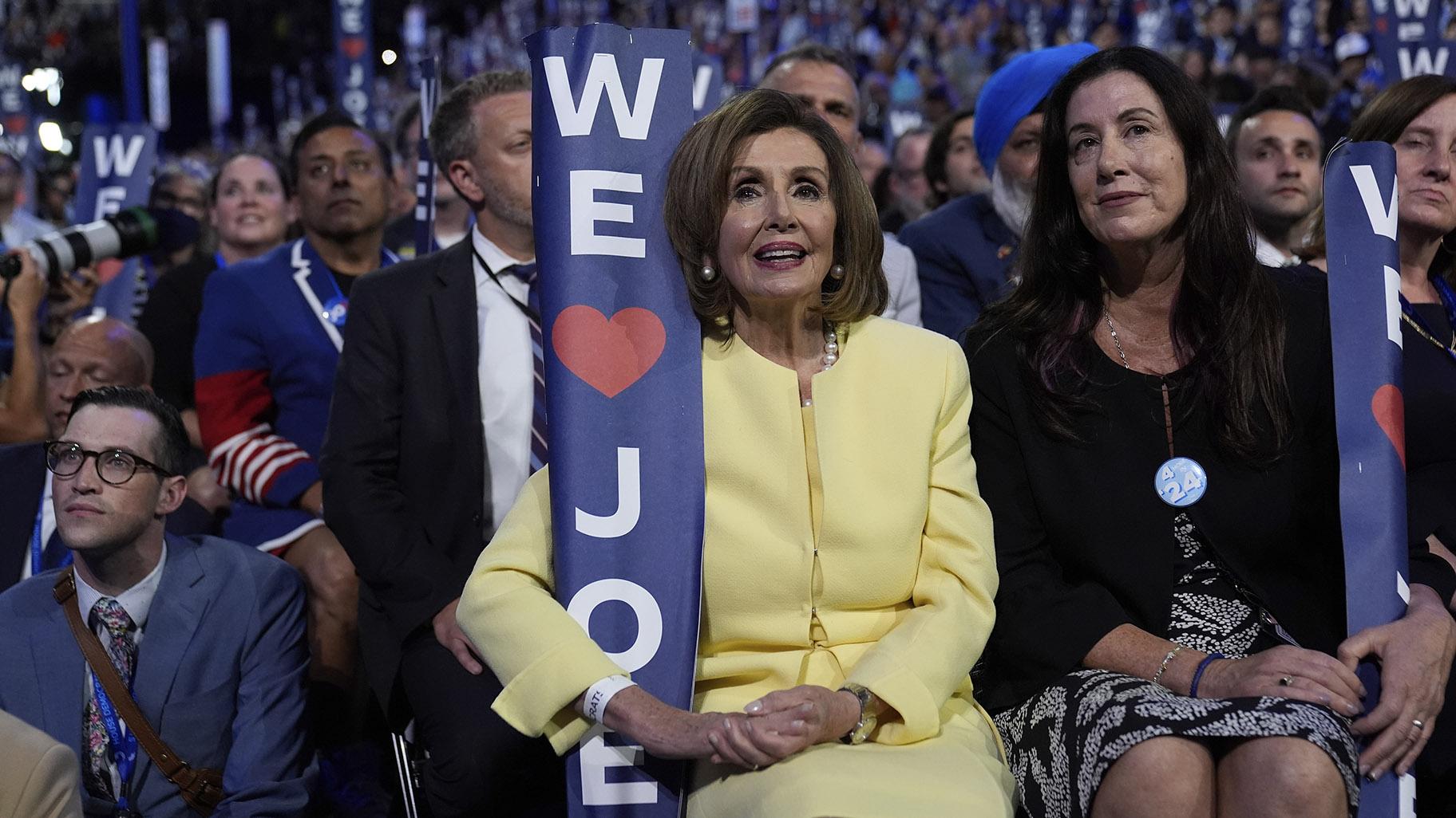 Rep. Nancy Pelosi, D-Calif., holds a sign as President Joe Biden speaks during the Democratic National Convention Monday, Aug. 19, 2024, in Chicago. (AP Photo / Paul Sancya)