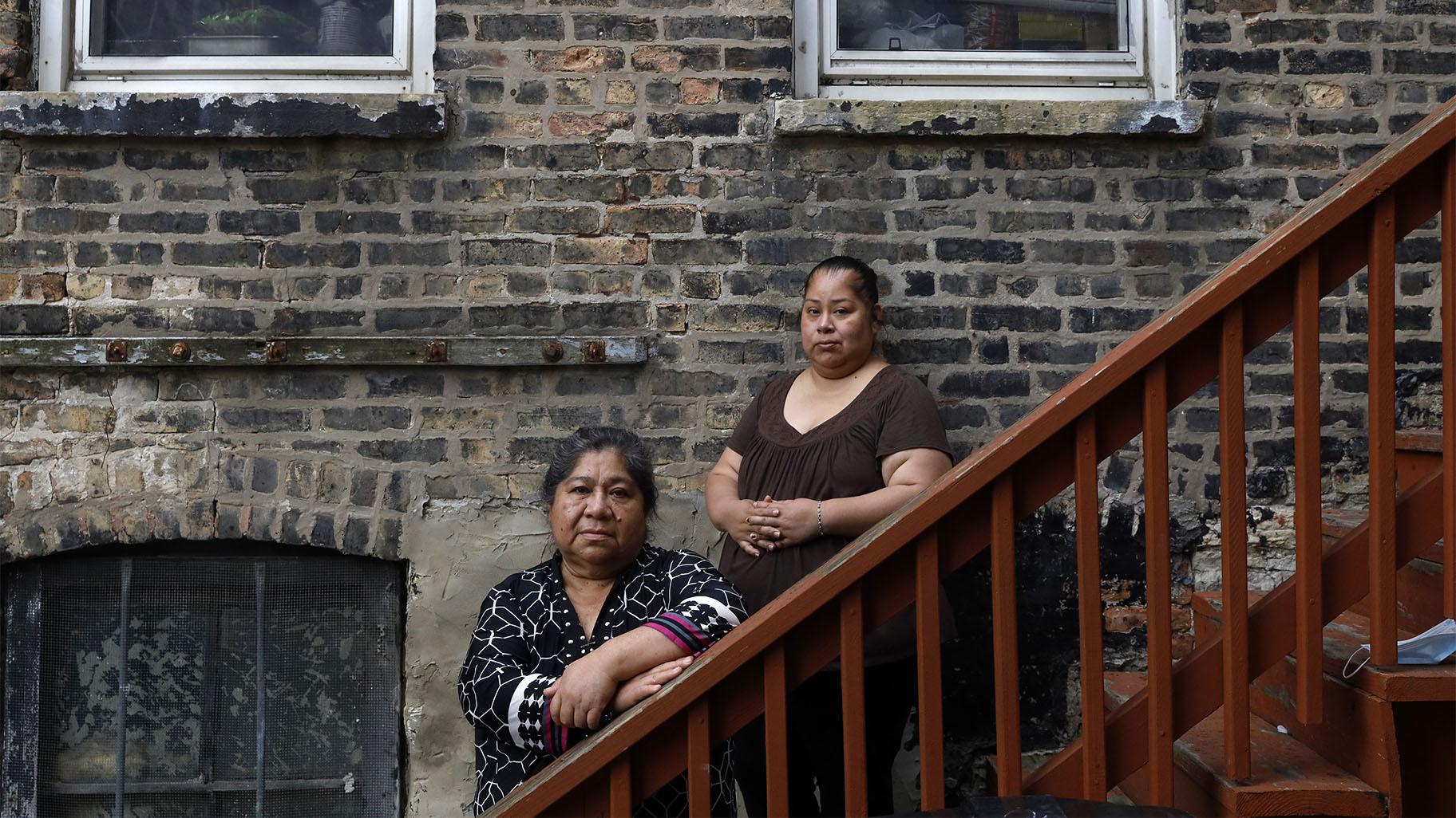 Maria Elena Estamilla, 62, left and her daughter Esmeralda Triquiz pose for a photo June 30, 2021, in Chicago’s Pilsen neighborhood. (AP Photo / Shafkat Anowar)