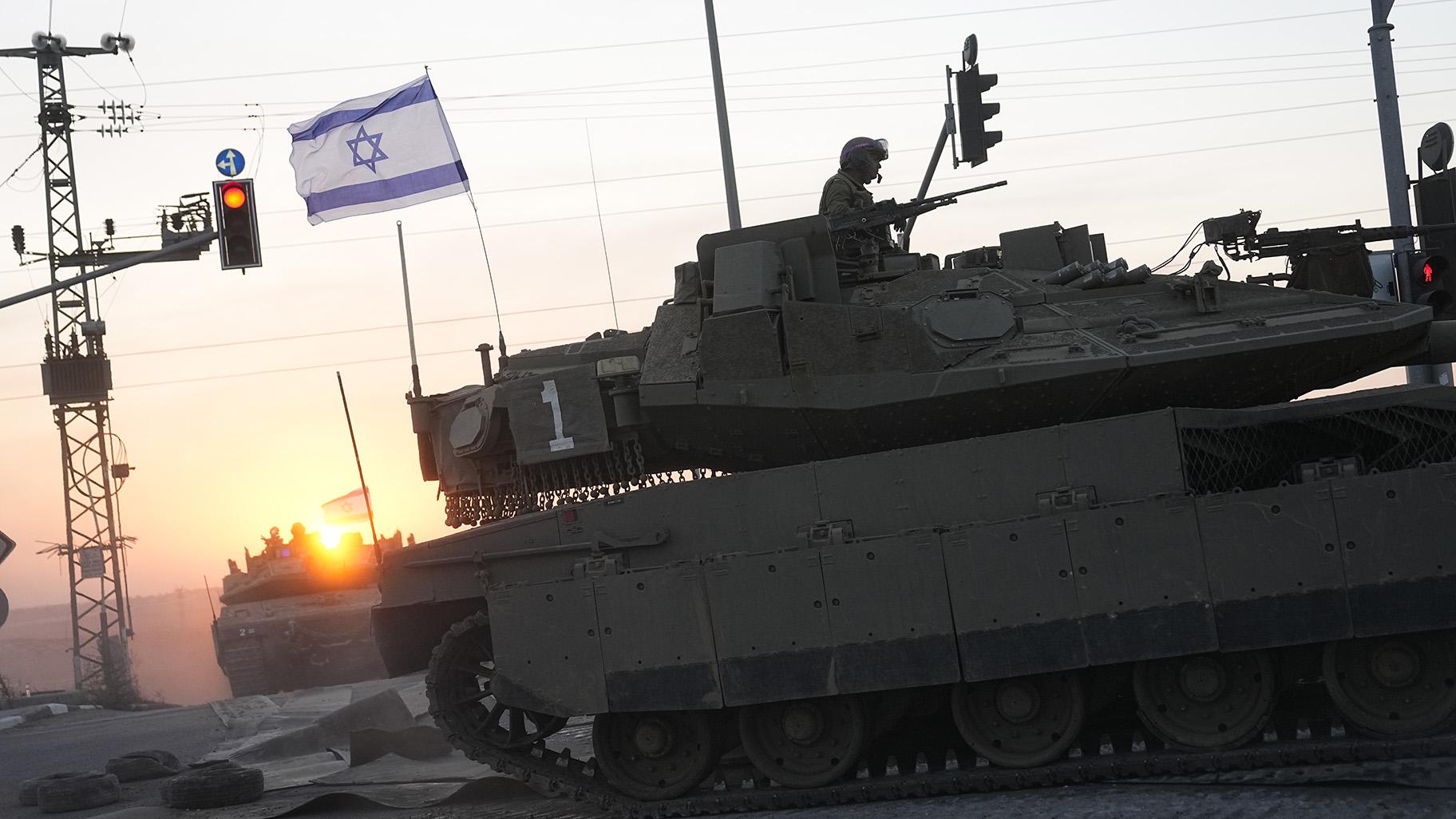 sraeli tanks head towards the Gaza Strip border in southern Israel on Thursday, Oct.12, 2023. (AP Photo / Ohad Zwigenberg)