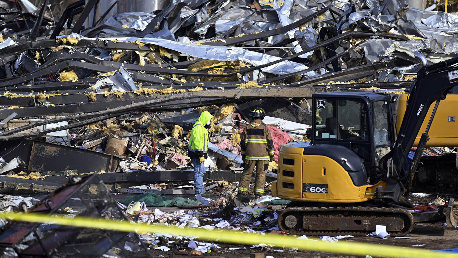 Emergency response workers dig through the rubble of the Mayfield Consumer Products candle factory in Mayfield, Ky., Saturday, Dec. 11, 2021. Tornadoes and severe weather caused catastrophic damage across multiple states late Friday, killing several people overnight. (AP Photo / Timothy D. Easley)
