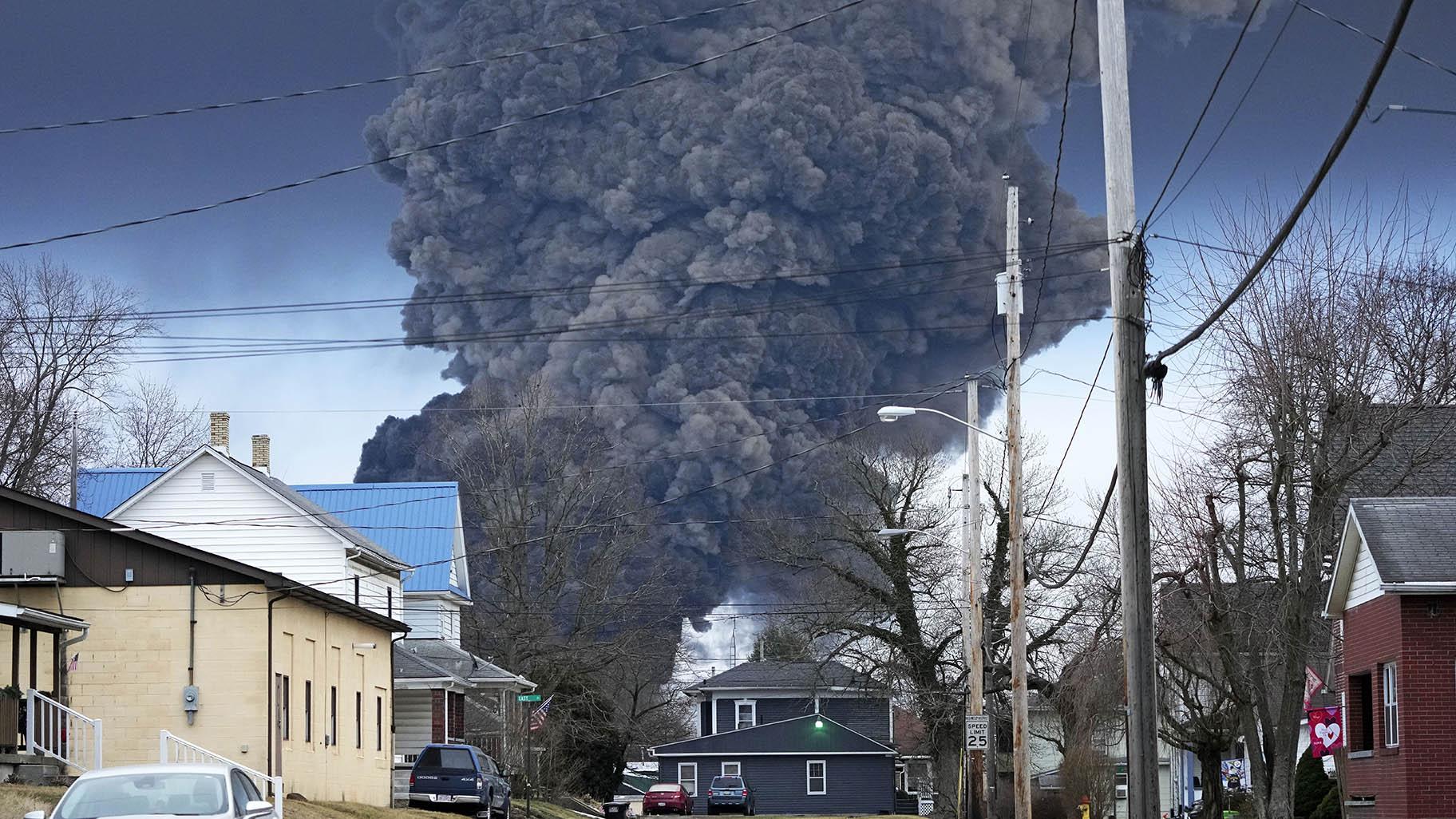 A black plume rises over East Palestine, Ohio, as a result of a controlled detonation of a portion of the derailed Norfolk and Southern trains Monday, Feb. 6, 2023. (AP Photo / Gene J. Puskar)