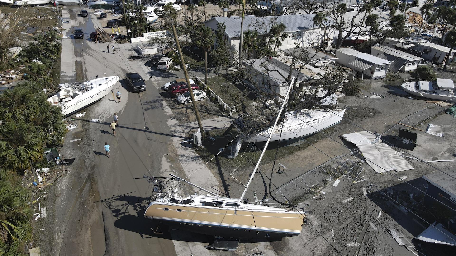 In this photo taken by a drone, boats lie scattered amidst mobile homes after the passage of Hurricane Ian, on San Carlos Island, in Fort Myers Beach, Fla., Thursday, Sept. 29, 2022. (AP Photo/Rebecca Blackwell)