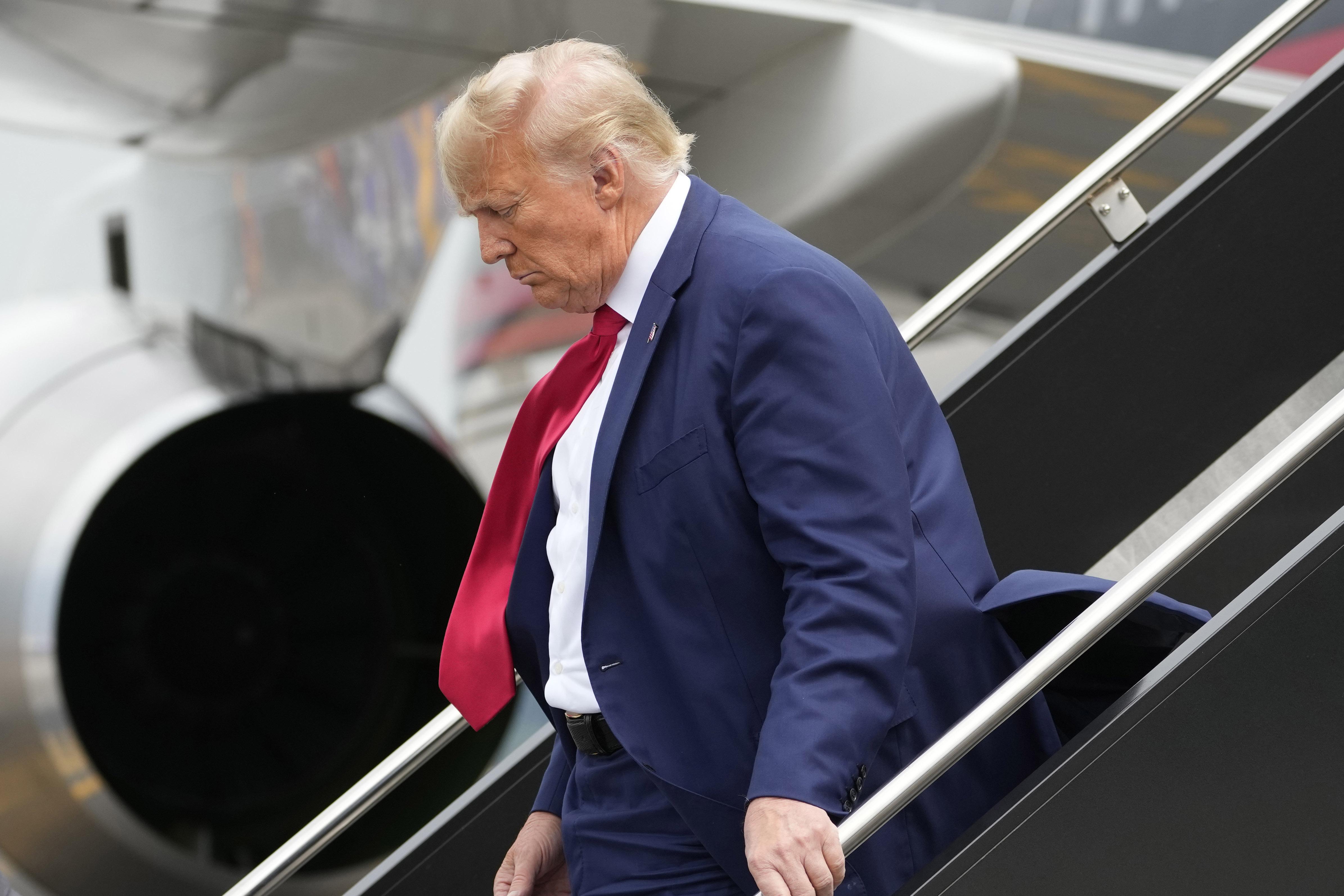 Former President Donald Trump arrives at Ronald Reagan Washington National Airport, Thursday, Aug. 3, 2023, in Arlington, Va., as he heads to Washington to face a judge on federal conspiracy charges alleging Trump conspired to subvert the 2020 election. (AP Photo / Alex Brandon)