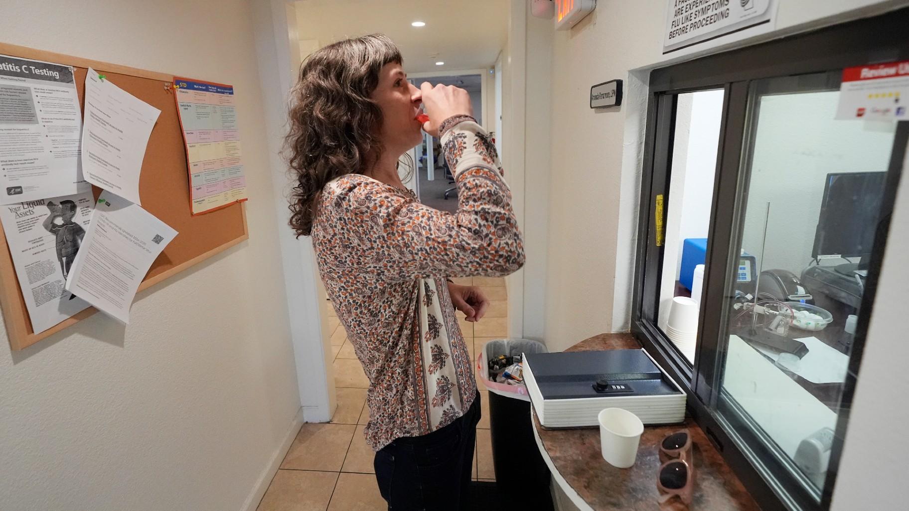 Methadone patient Irene Garnett, 44, of Phoenix, takes her treatment at a clinic in Scottsdale, Ariz., on Monday, Aug. 26, 2024. (Ross D. Franklin / AP Photo)