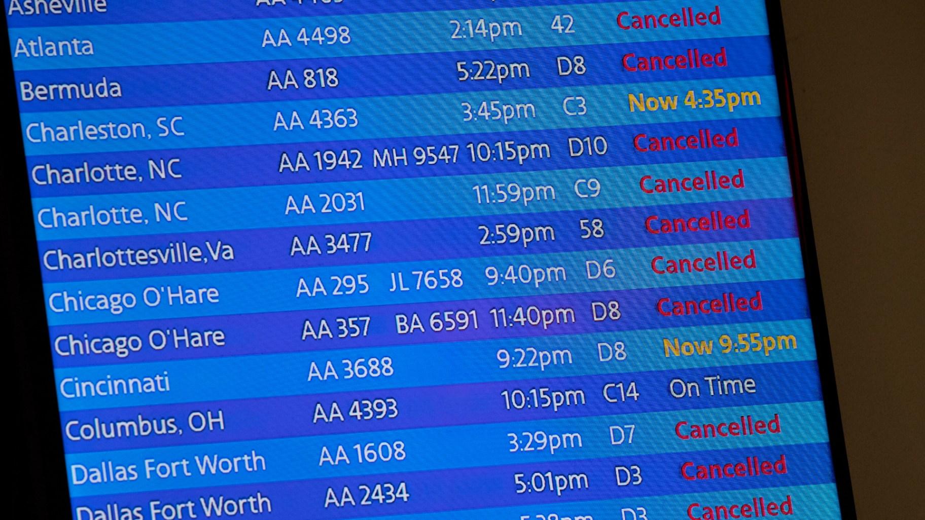The arrivals board at the American Airlines terminal at LaGuardia Airport displays the flights that have been canceled or delayed and one that is on time, March 21, 2020, in New York. (AP Photo / Mary Altaffer, File)