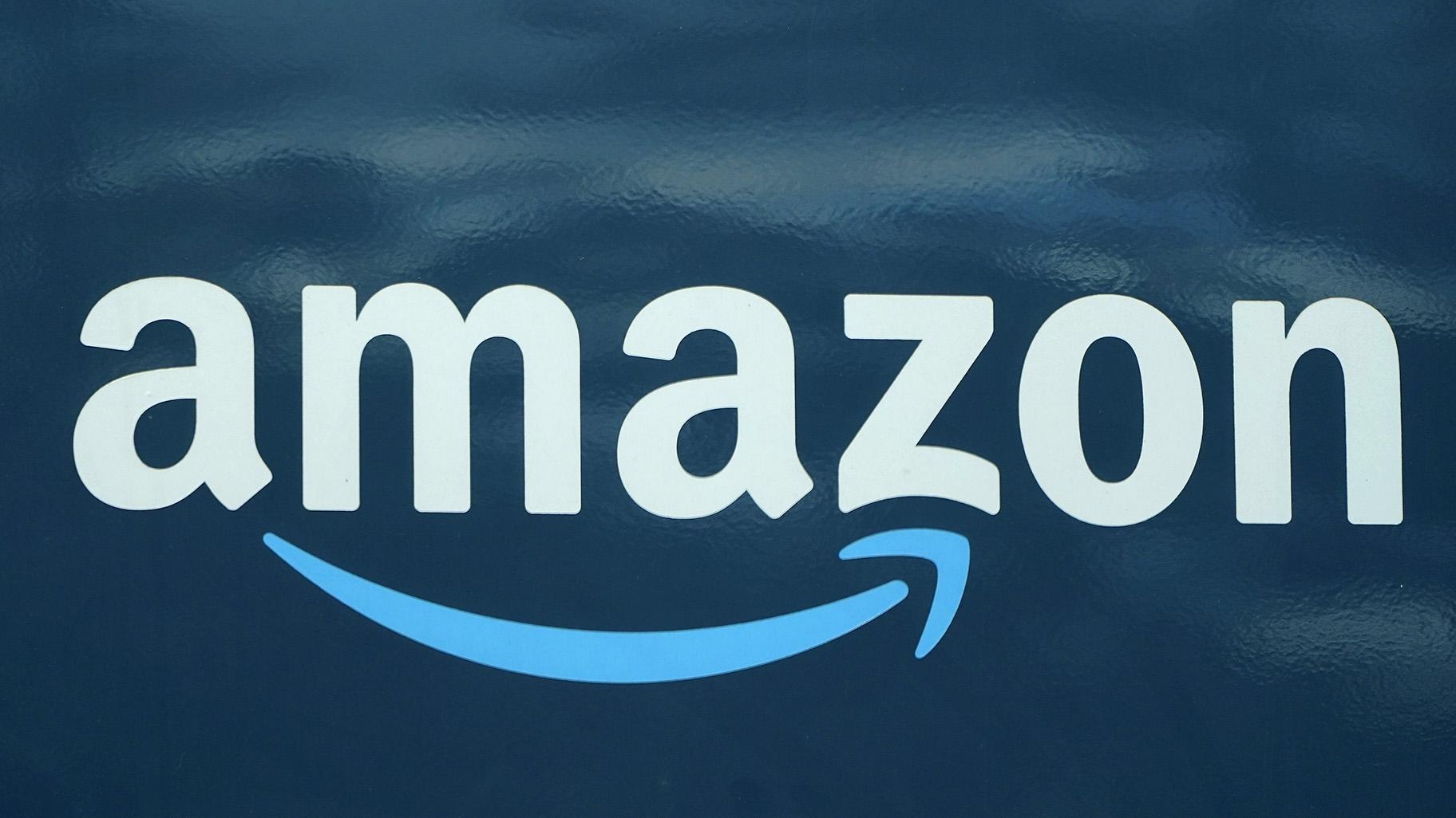 In this Oct. 1, 2020 file photo, an Amazon logo appears on an Amazon delivery van in Boston. (AP Photo / Steven Senne, File)