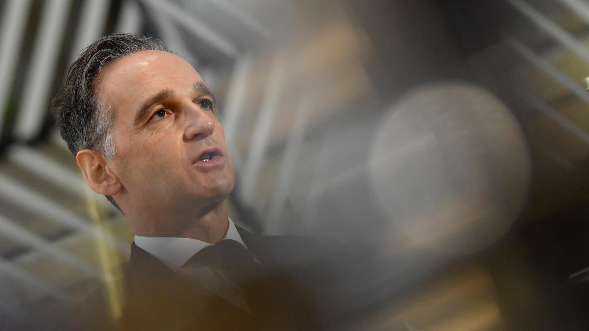 German Foreign Minister Heiko Maas speaks with the media as he arrives for a meeting of EU Foreign Ministers at the European Council building in Brussels, Monday Dec. 7, 2020. (John Thys, Pool via AP)