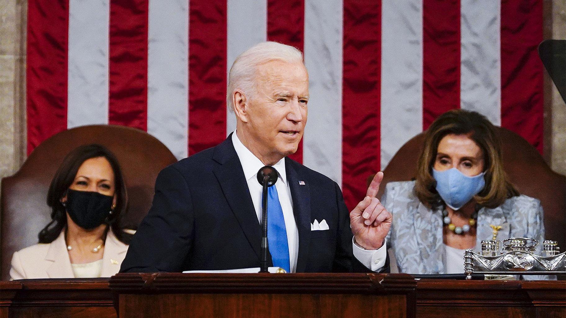 FILE - In this April 28, 2021, file photo President Joe Biden addresses a joint session of Congress in the House Chamber at the U.S. Capitol in Washington, as Vice President Kamala Harris, left, and House Speaker Nancy Pelosi of Calif., look on.  (Melina Mara / The Washington Post via AP, Pool)