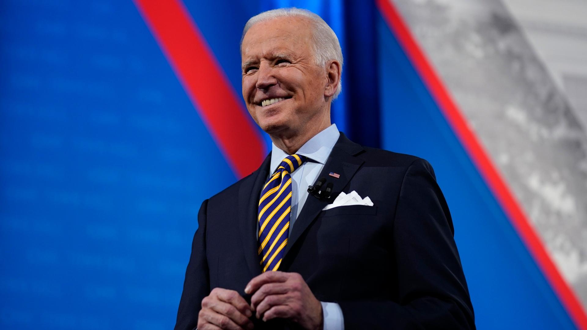 President Joe Biden stands on stage during a break in a televised town hall event at Pabst Theater, Tuesday, Feb. 16, 2021, in Milwaukee. (AP Photo / Evan Vucci)